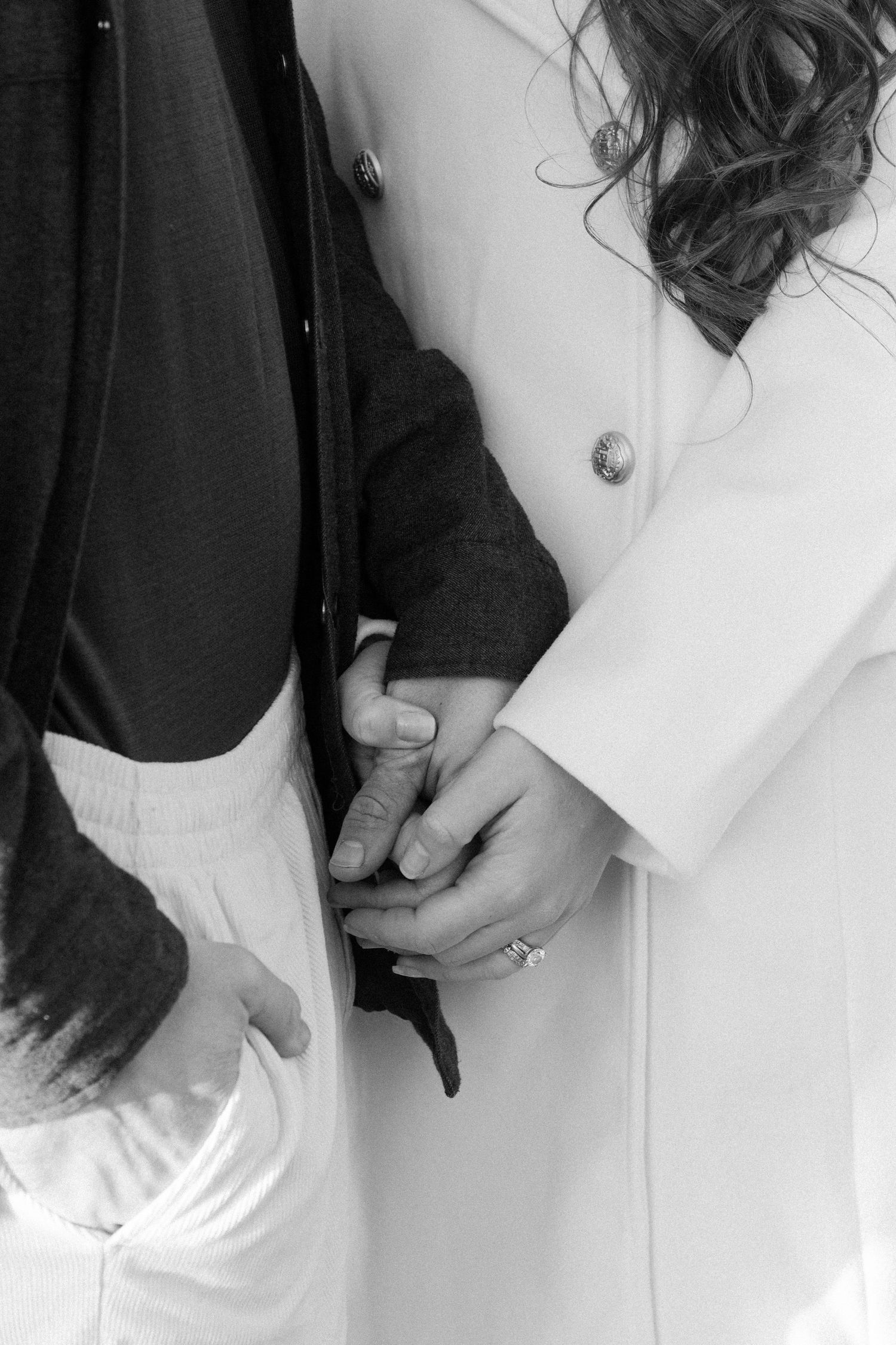 A black and white photo series showing hands wearing rings and jewelry against a white background.