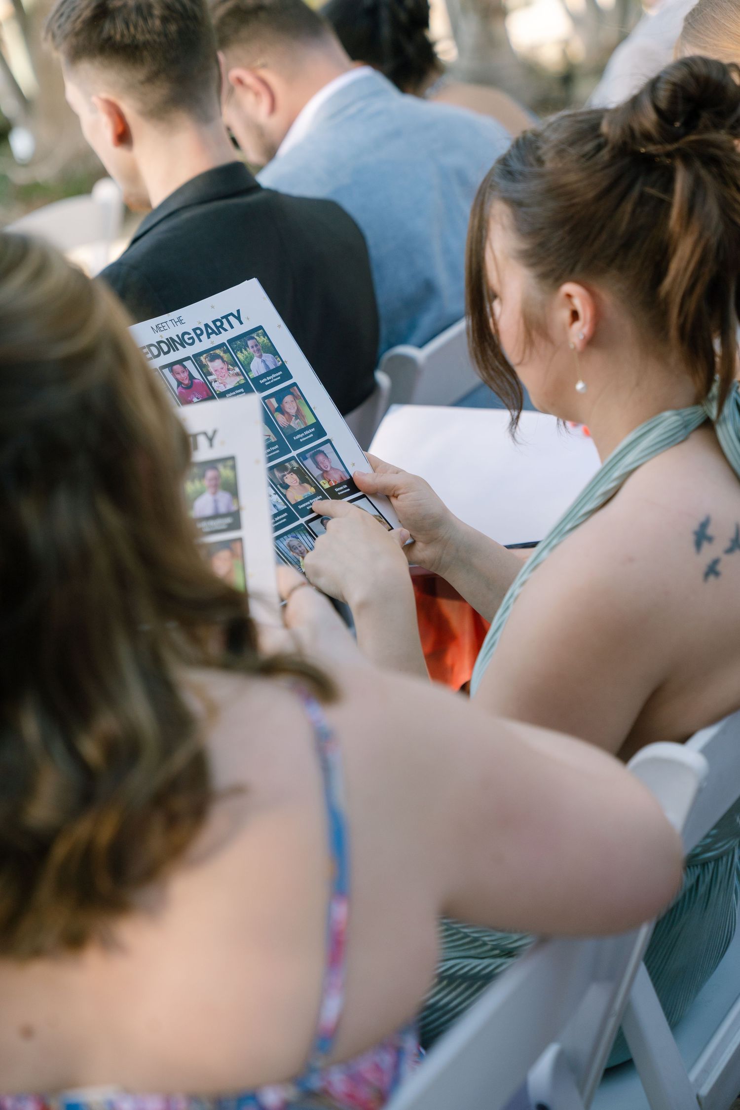 A group of people looking at a shared screen or device together.