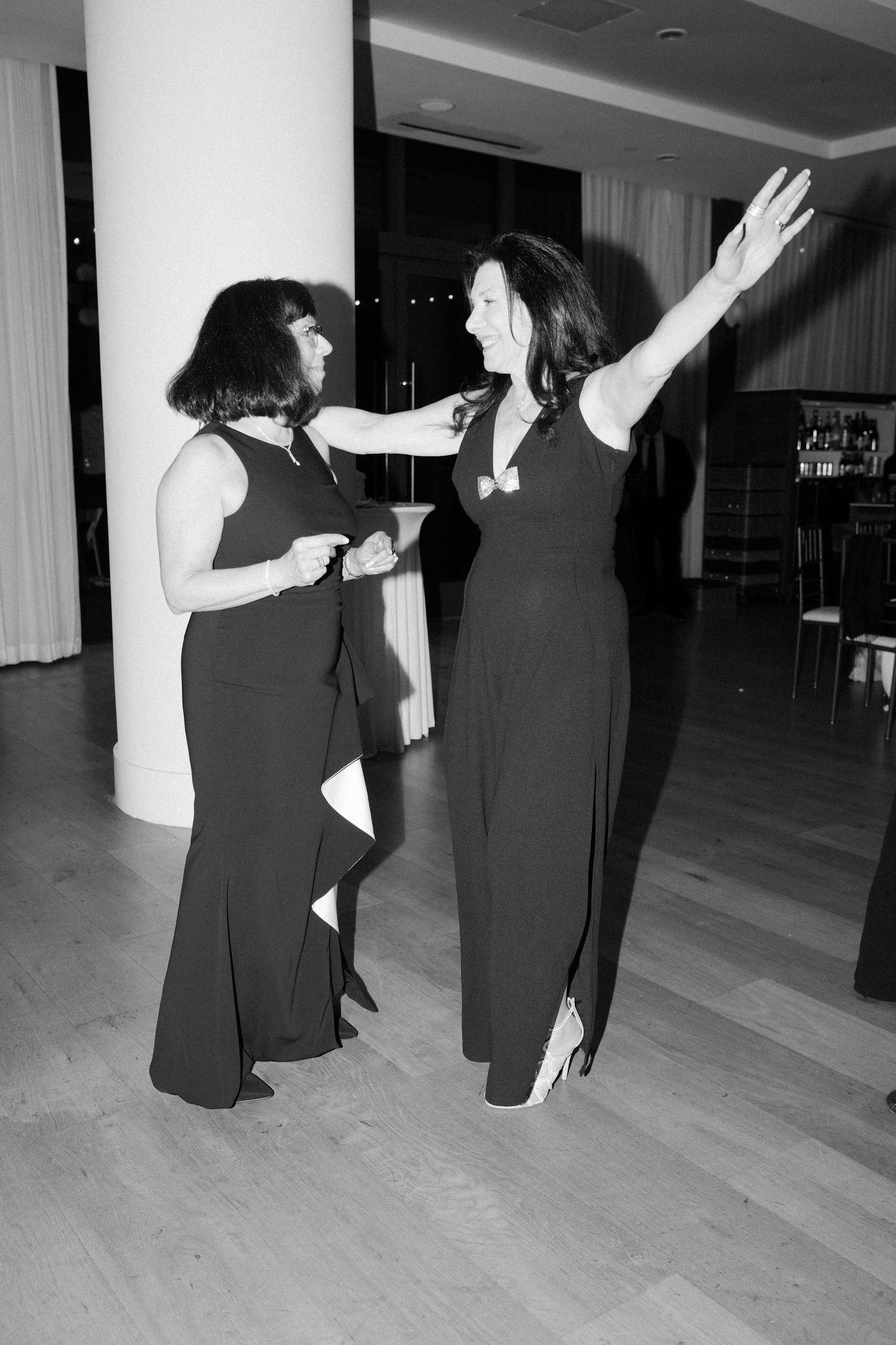 Black and white photos of guests dancing at a wedding reception.