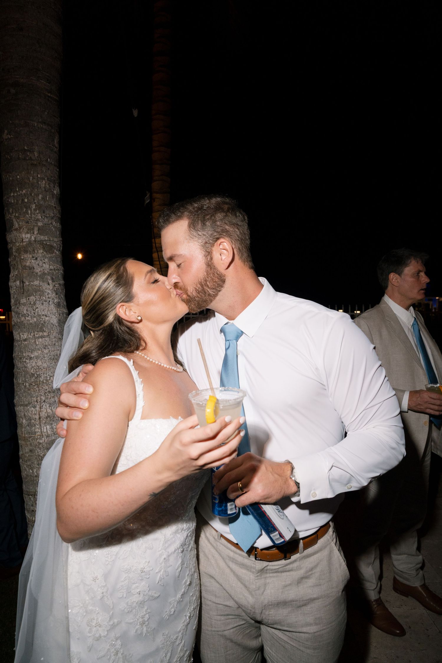 Newlyweds share intimate dance moments at their nighttime reception.