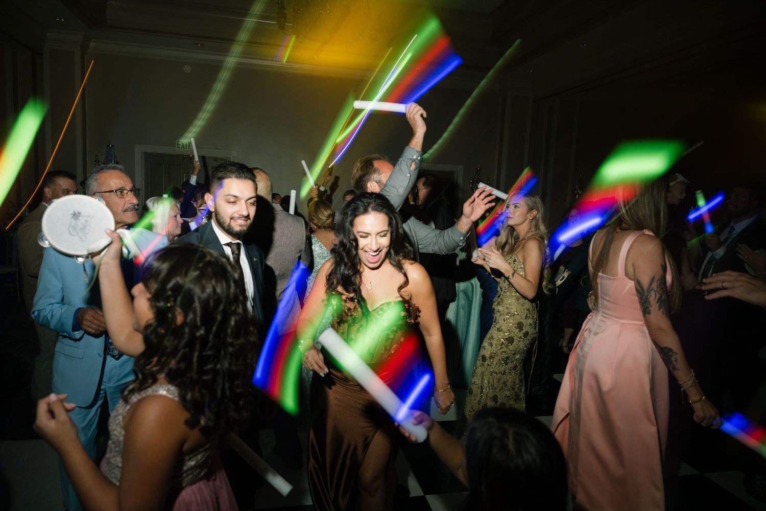 Dance party with colorful lighting effects and silhouetted dancers.