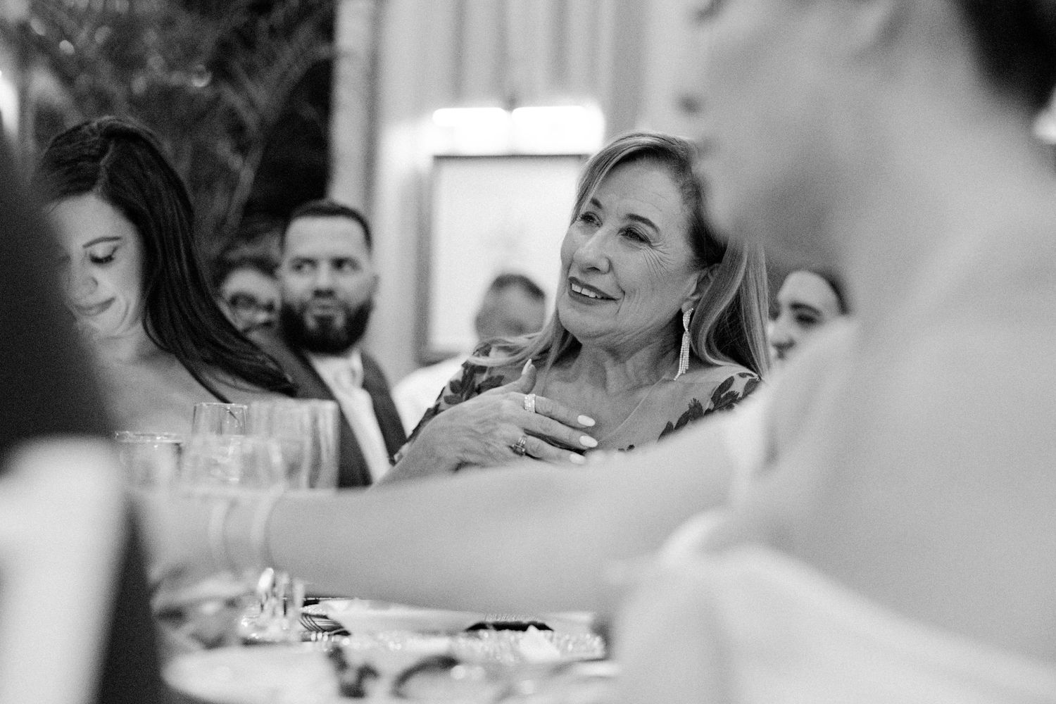 A touching moment as an emotional bride shared joyful tears with loved ones during the wedding reception.