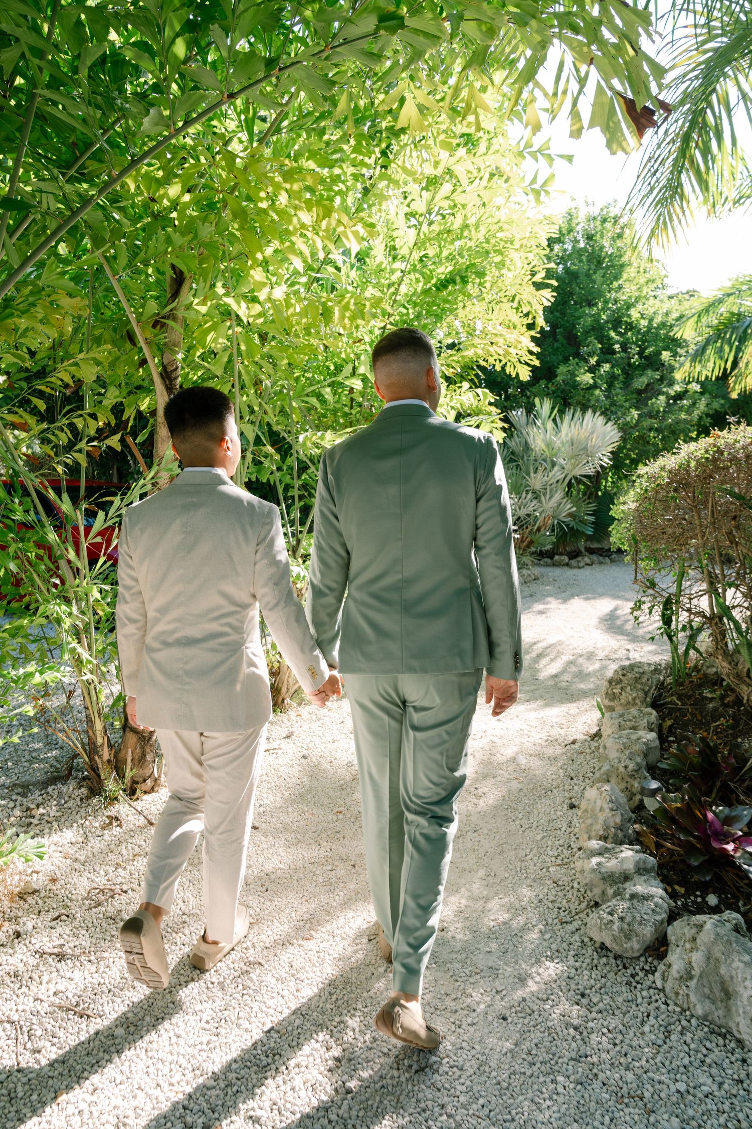 Multiple images of two people walking together on a garden path surrounded by lush tropical greenery.