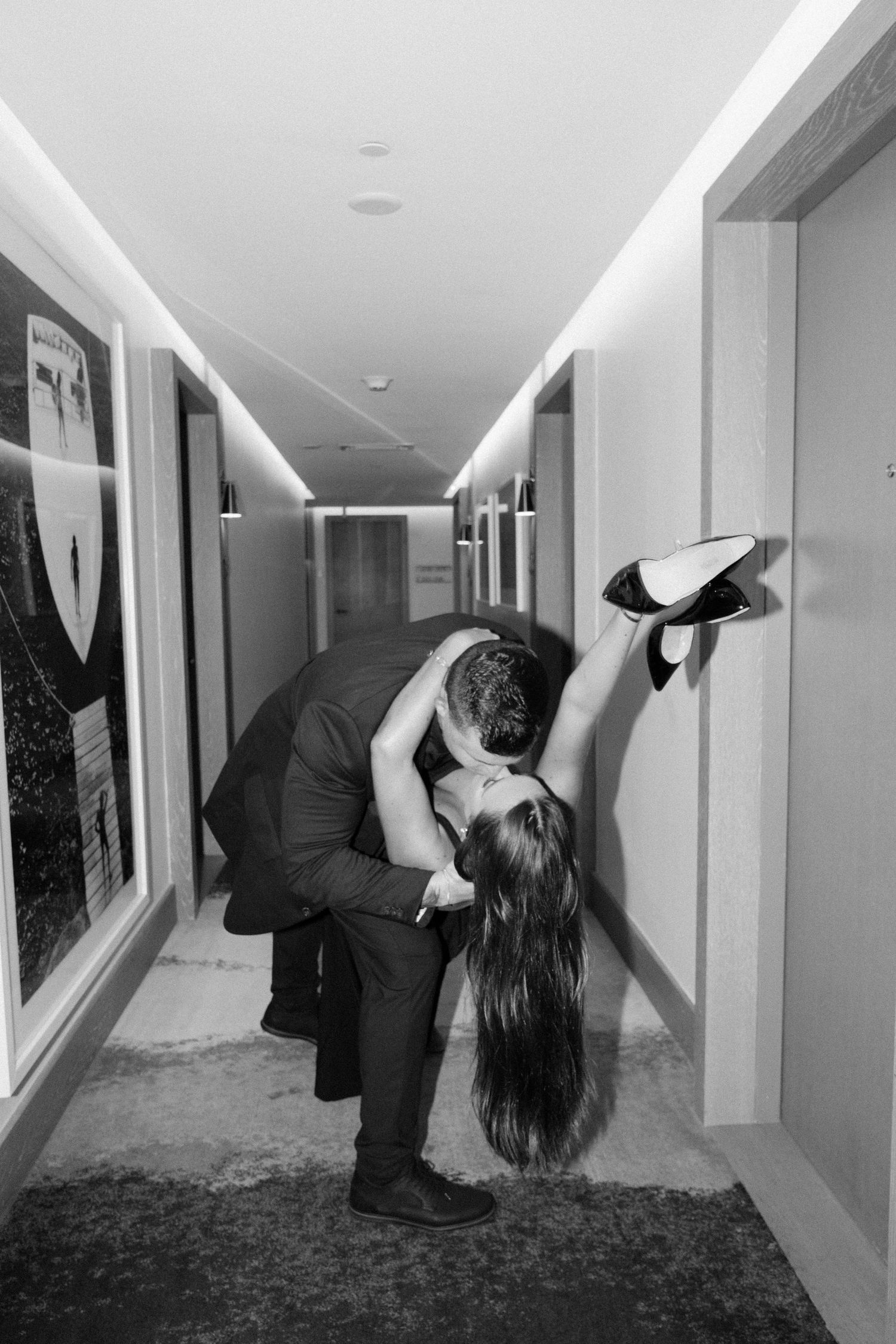A black and white photo series shows a person performing a levitation illusion in a hallway.
