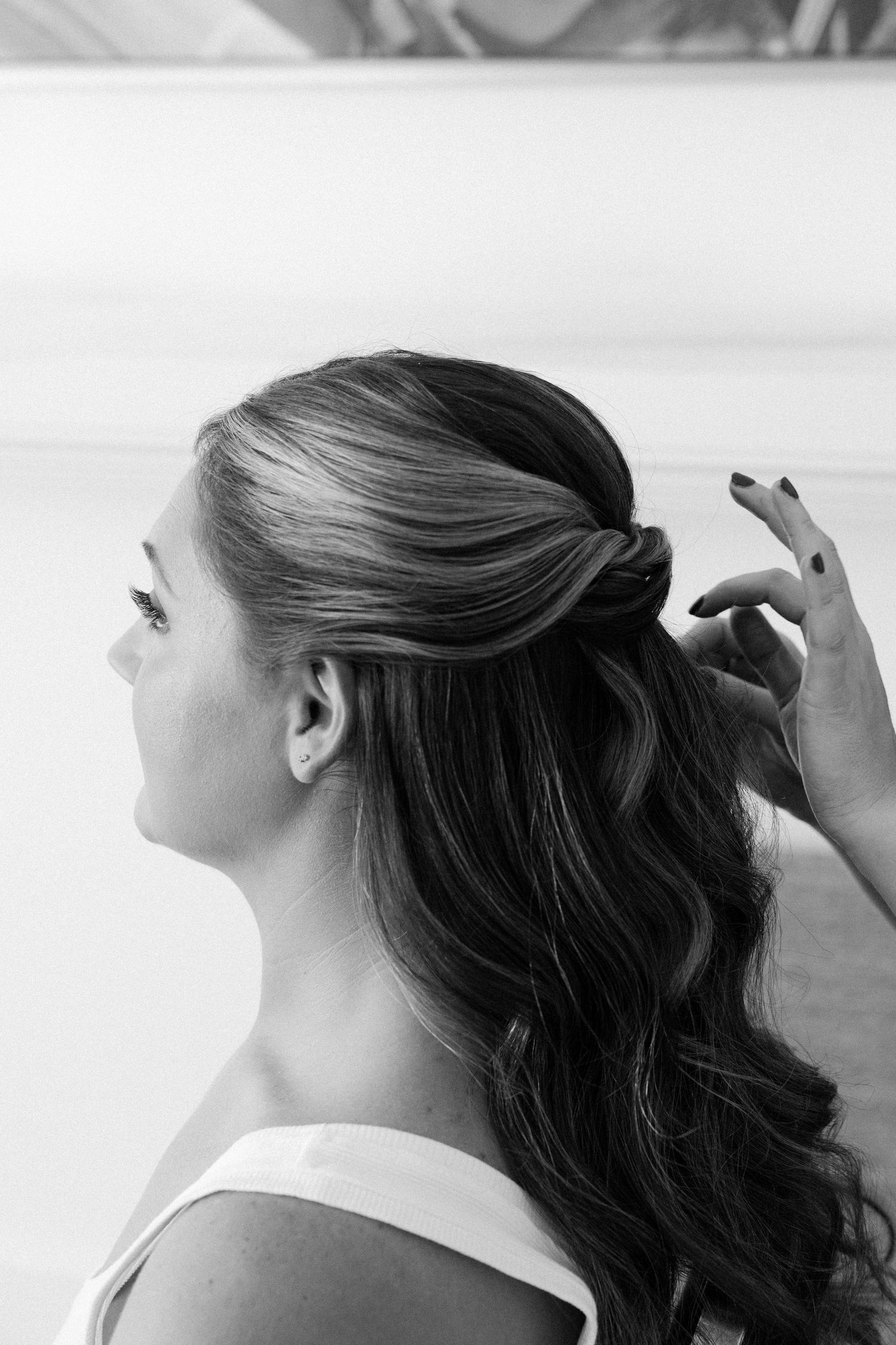 Close-up sequence of a hairstyling session showing elegant updo preparation.
