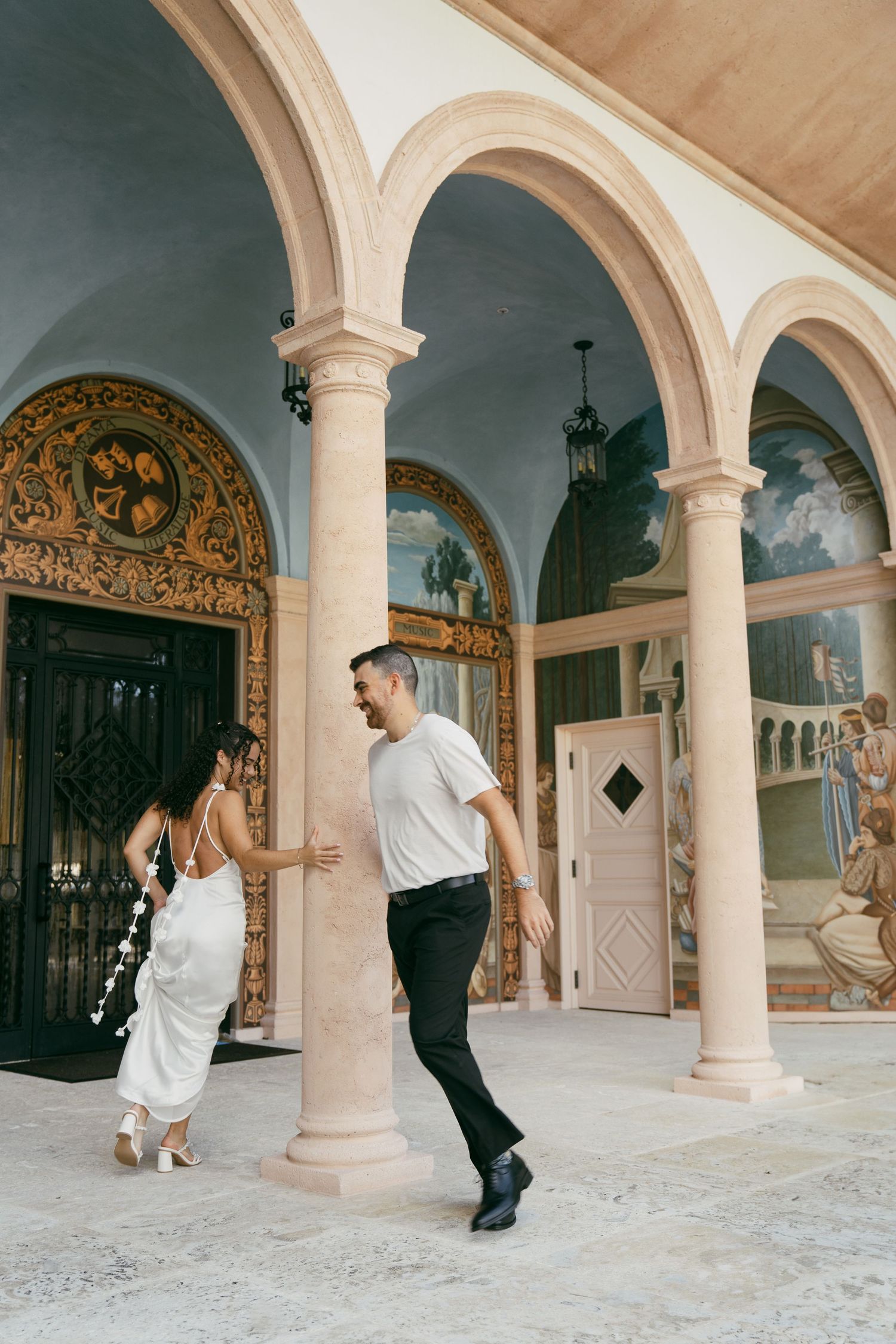 Artistic dance movements captured in a series of frames under elegant arched corridor with ornate architectural details.