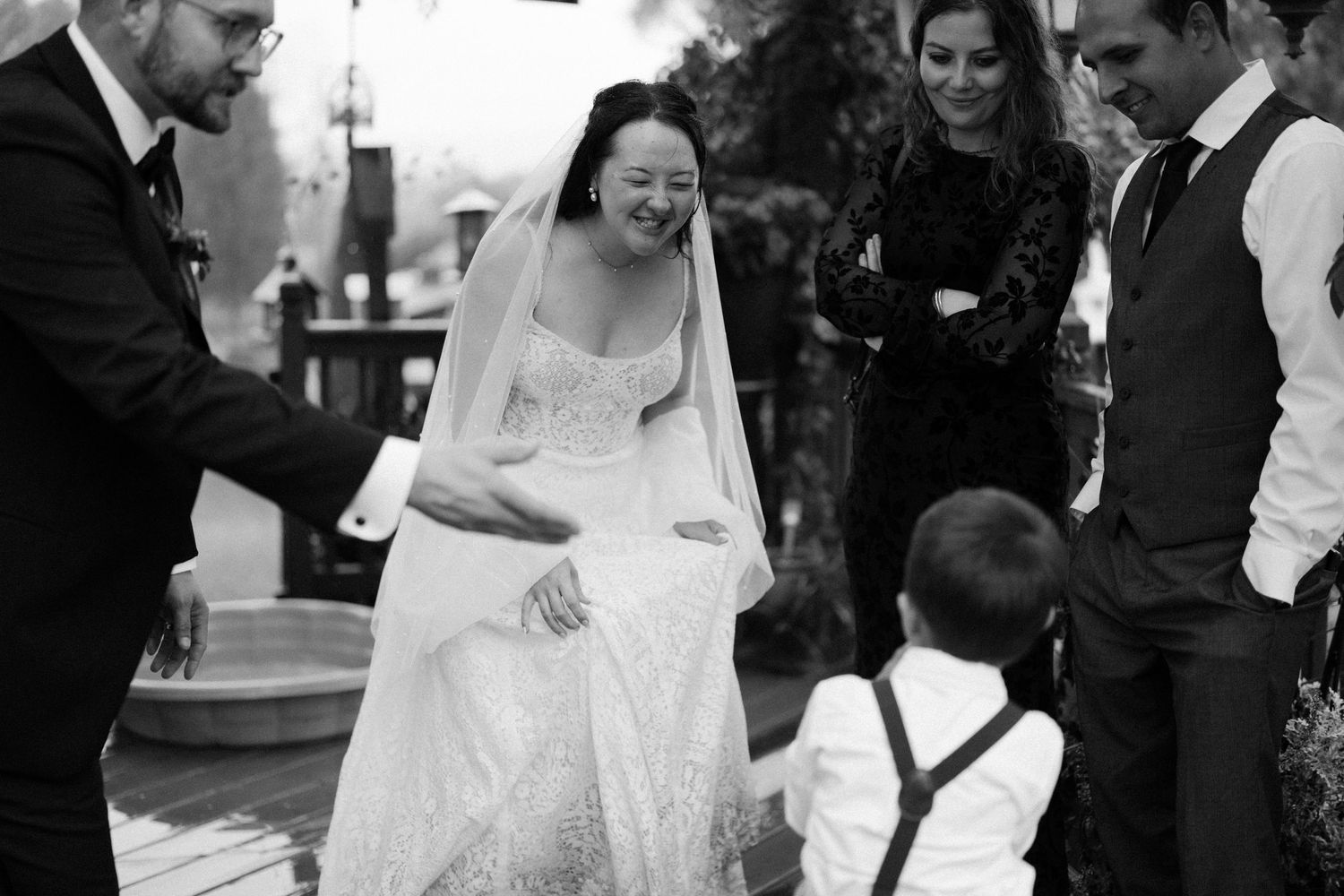 A bride and groom share a joyful moment during their wedding celebration.