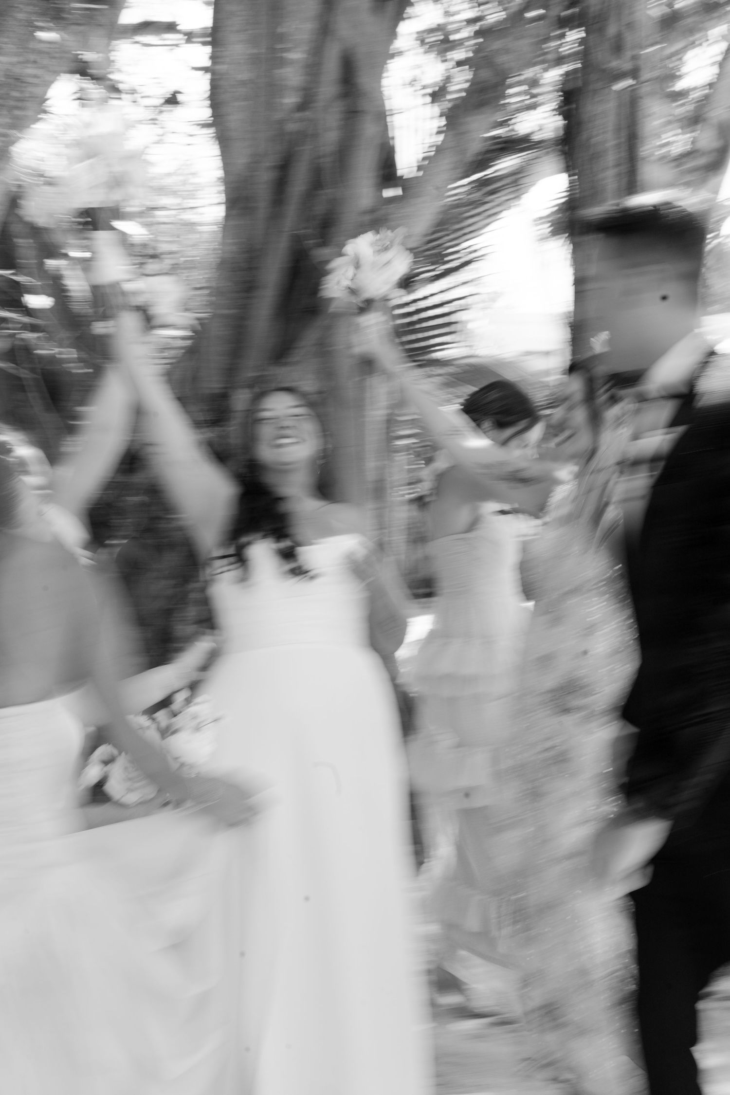 A blurred image of a crowded scene, with people in motion and indistinct shapes in the background.