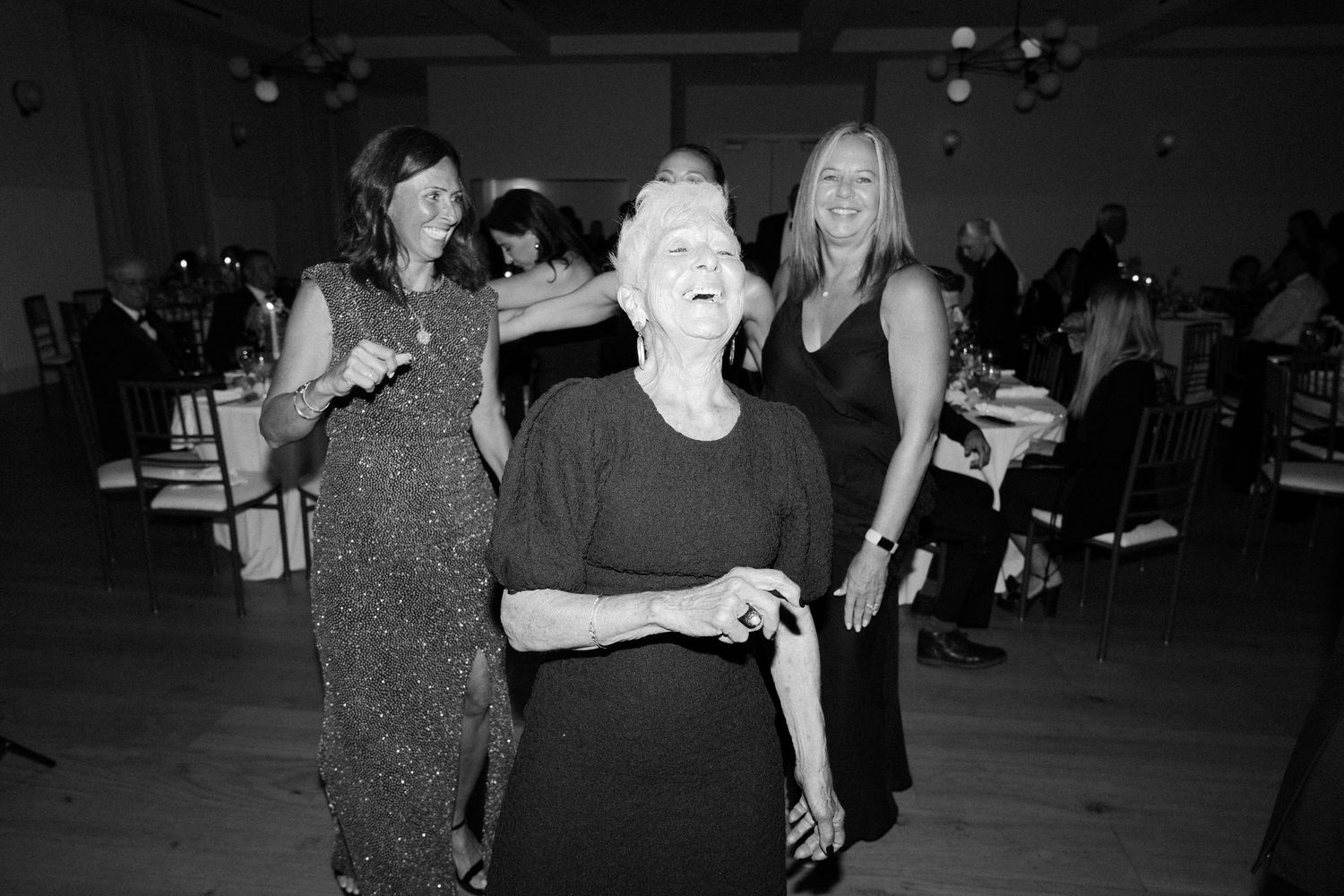 Wedding celebration dance floor filled with guests enjoying the evening festivities.