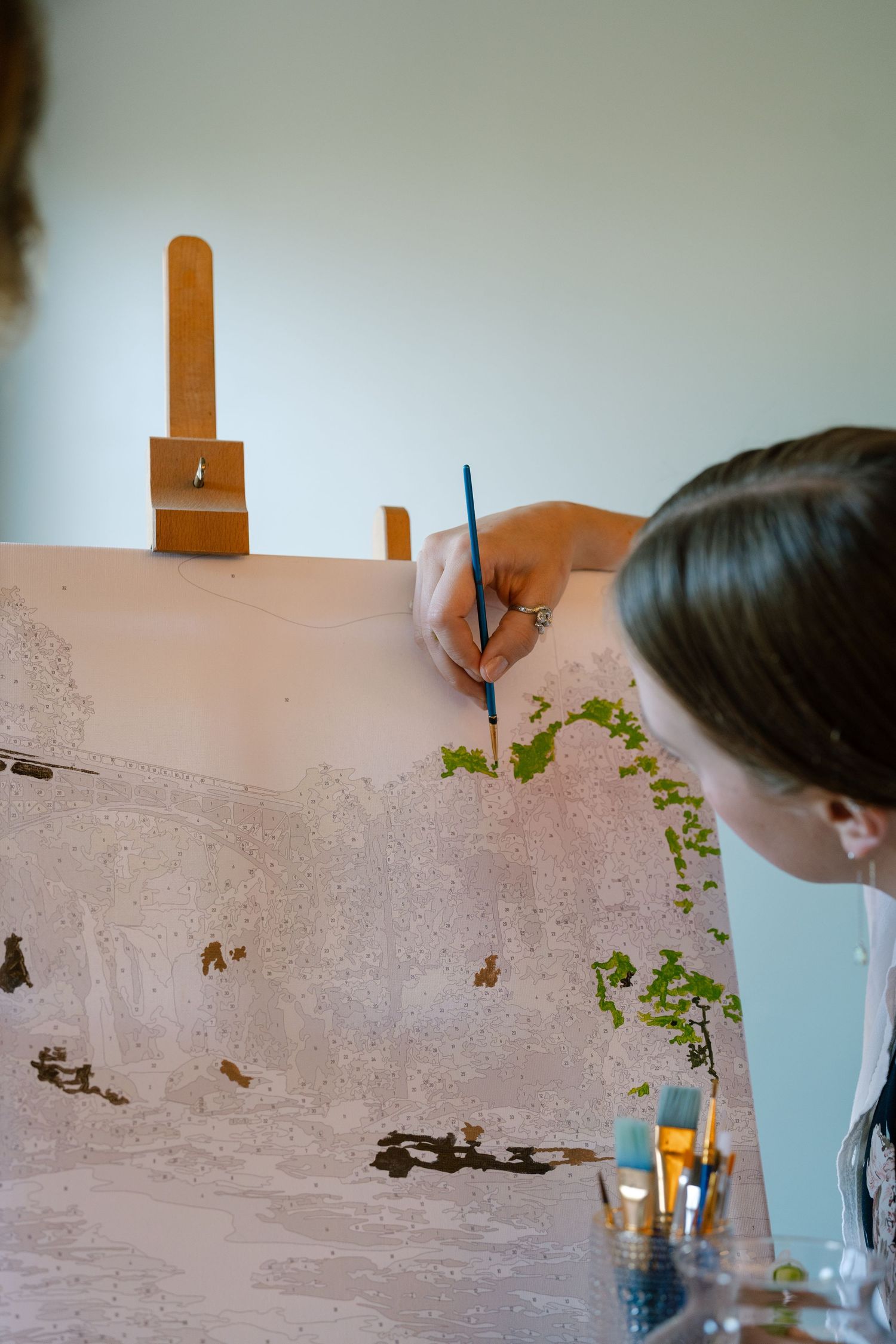 A series of artistic shots showing someone signing a document.