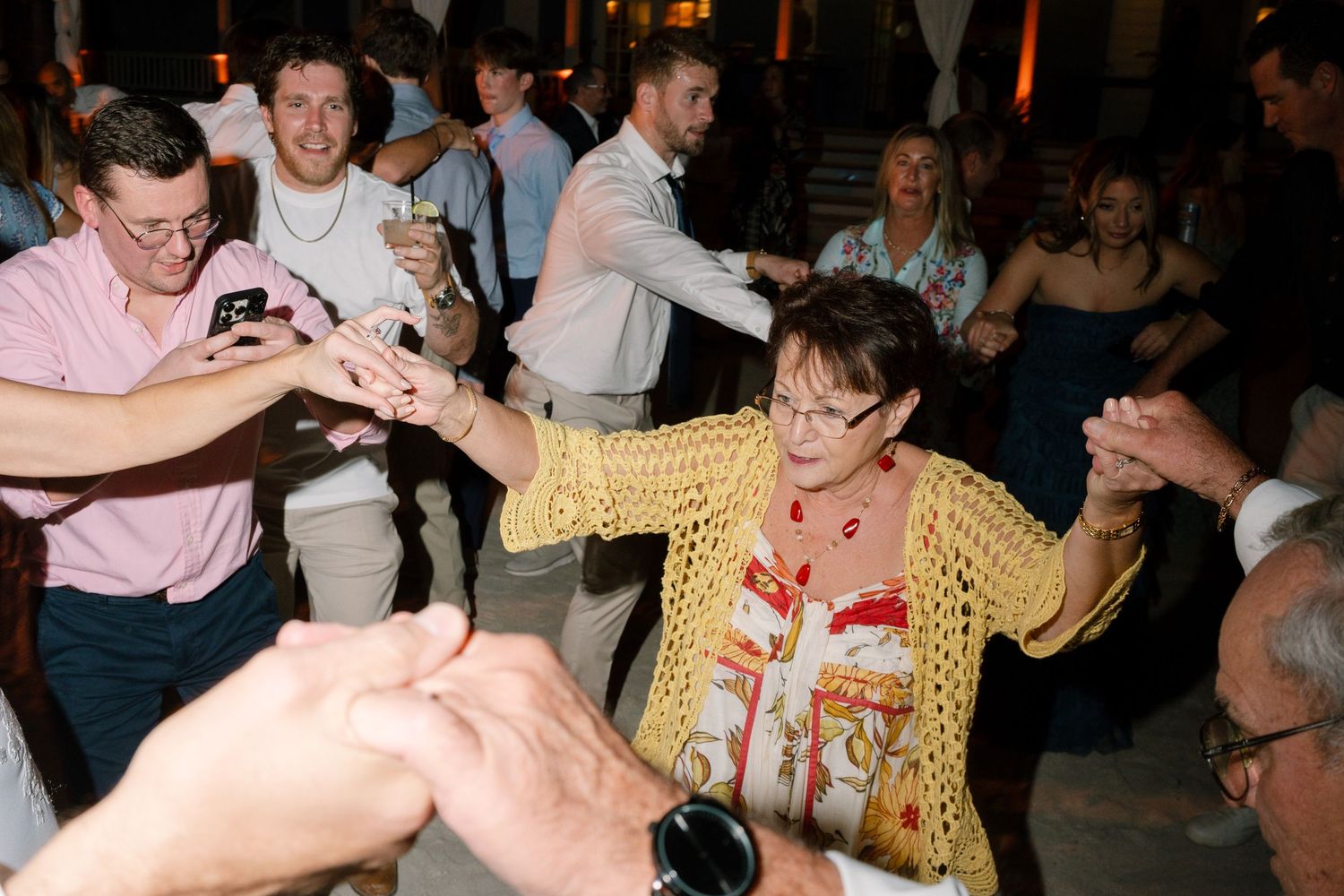 Lively dance floor scene with guests enjoying themselves at a festive celebration.
