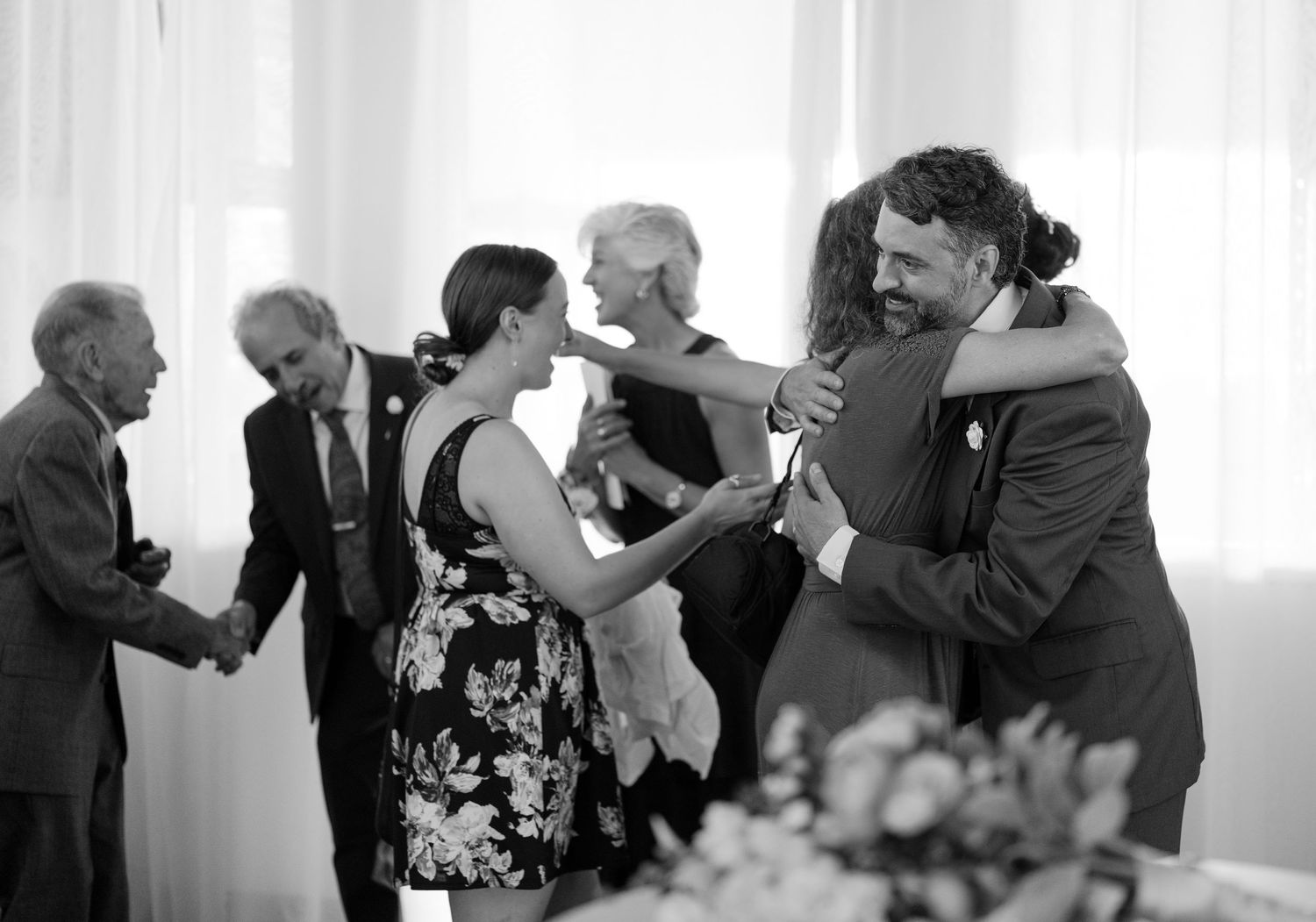 A black and white sequence showing couples dancing together at a wedding reception.