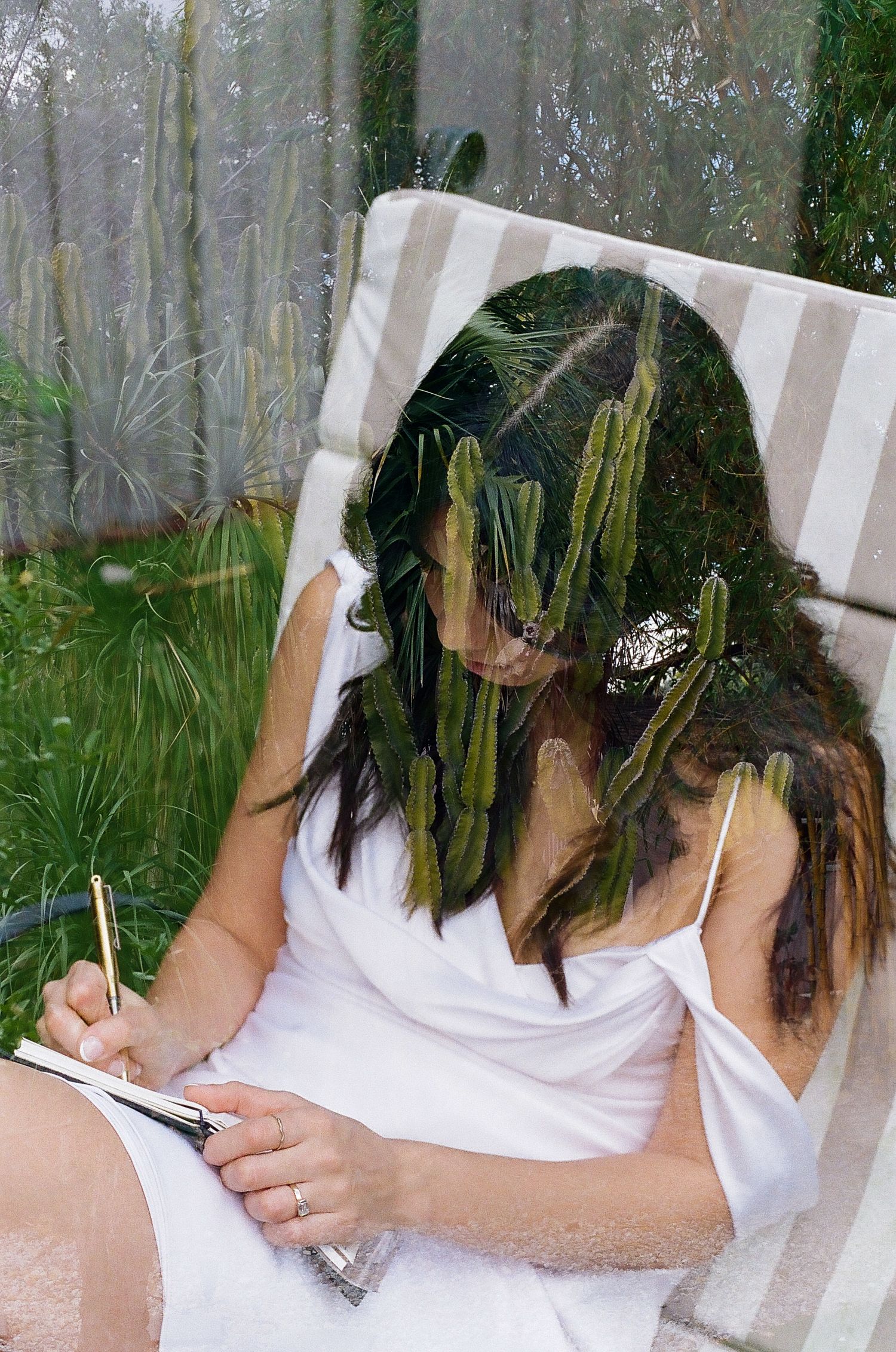 A sequence of five similar photos showing someone writing or signing a document against a blurred green background.