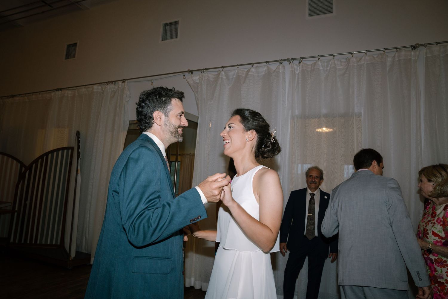 Wedding reception dance floor scenes showing guests celebrating and dancing together.