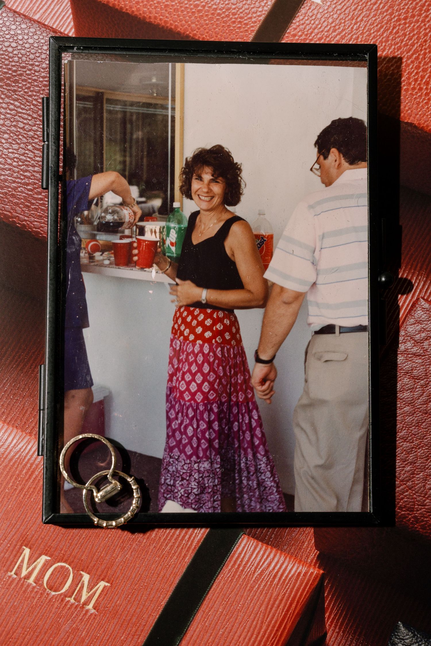Vintage photo album showing red polka dot dress in multiple frames.