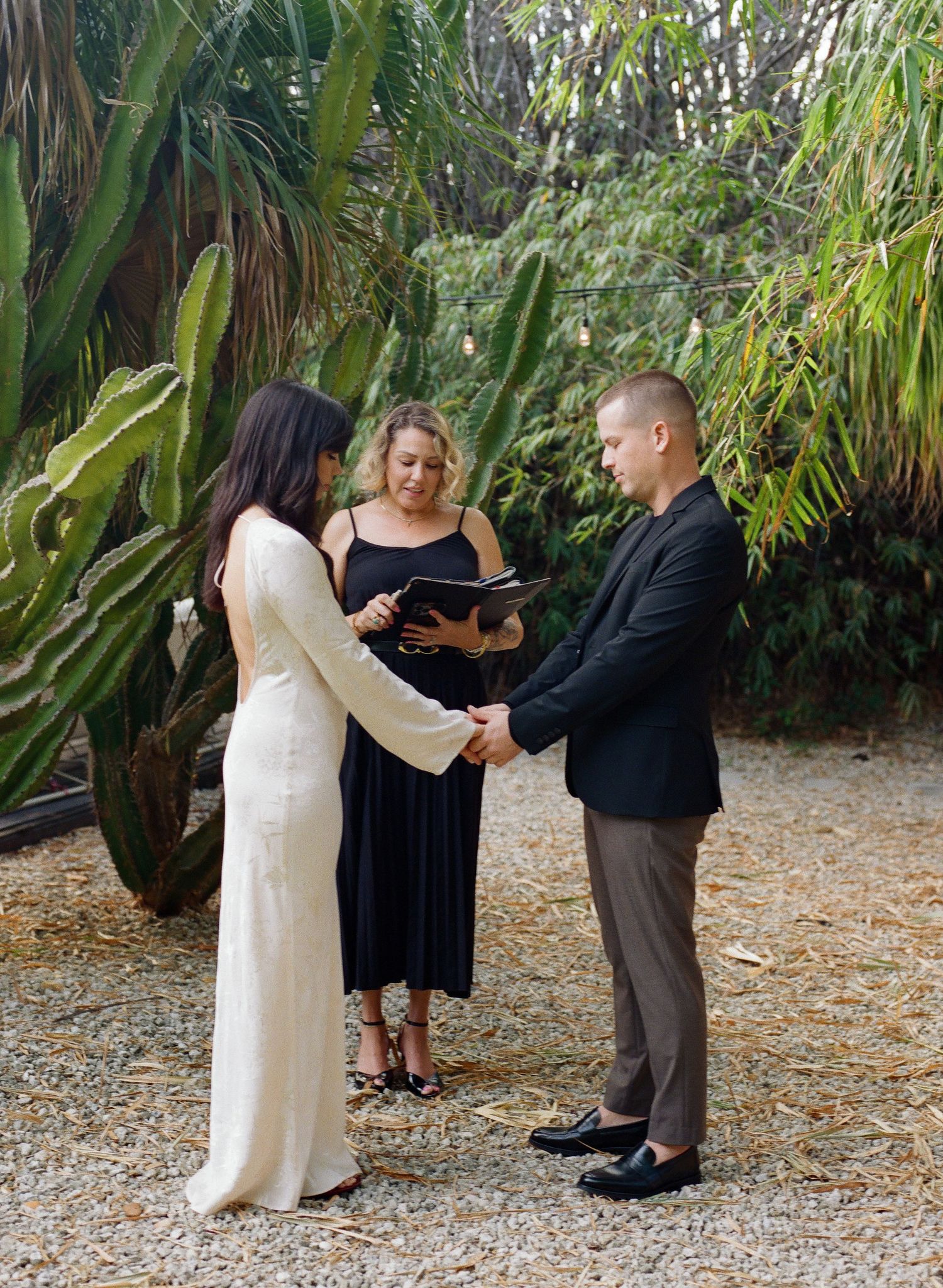 A wedding ceremony sequence showing a couple exchanging vows in a lush tropical garden setting.