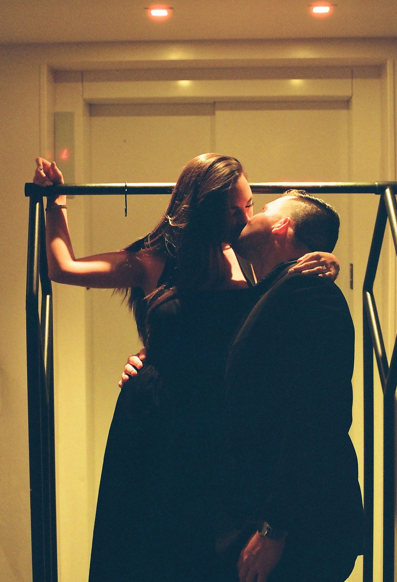 A series of connected photos showing two dancers performing an intimate contemporary dance sequence in a studio.