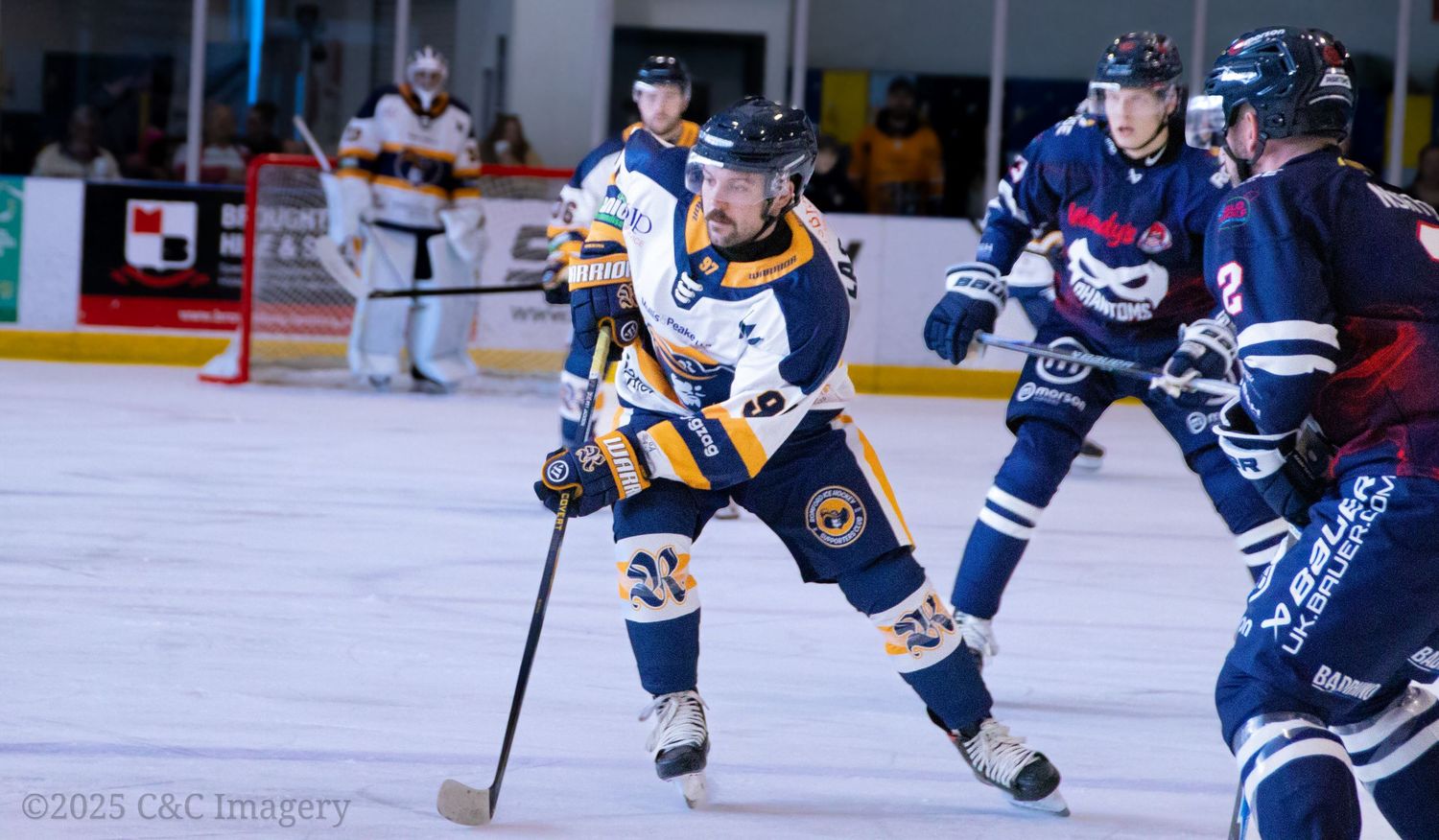 Hockey players battle for possession during an intense game on the ice.