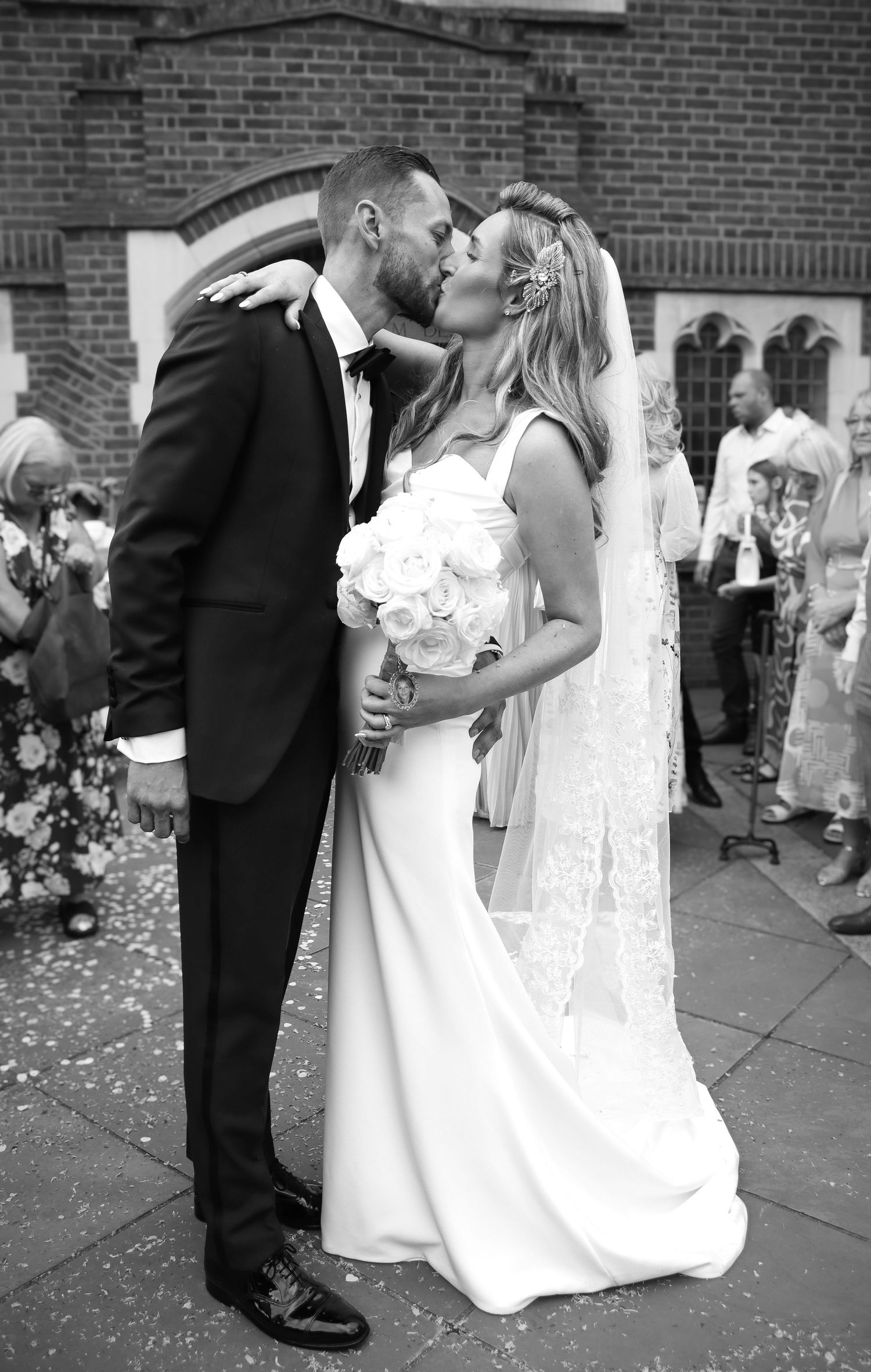 Sequence of romantic wedding moments captured outside brick building with confetti.