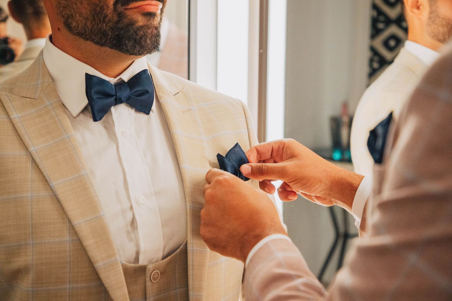 Wedding preparation details showing formal attire and accessories in neutral tones.