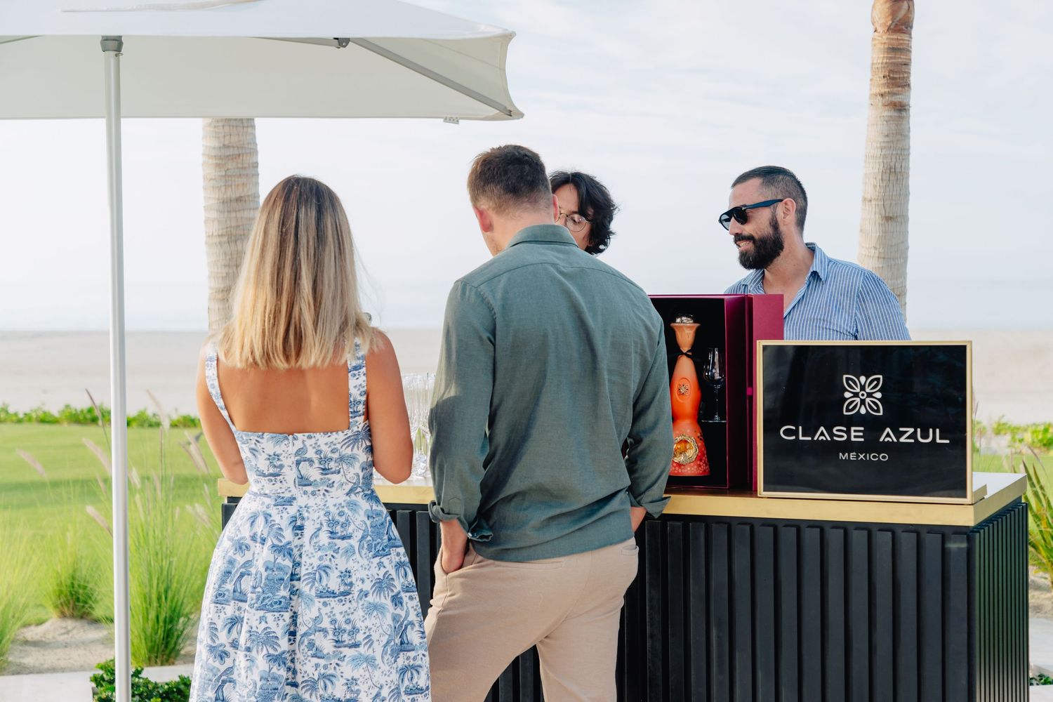 Sleek outdoor bar station with Club de Soul branding under white canopy.