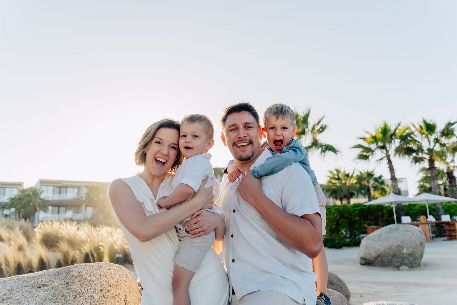 A sequence of beachside images shows a family spending joyful moments together at sunset near palm trees.