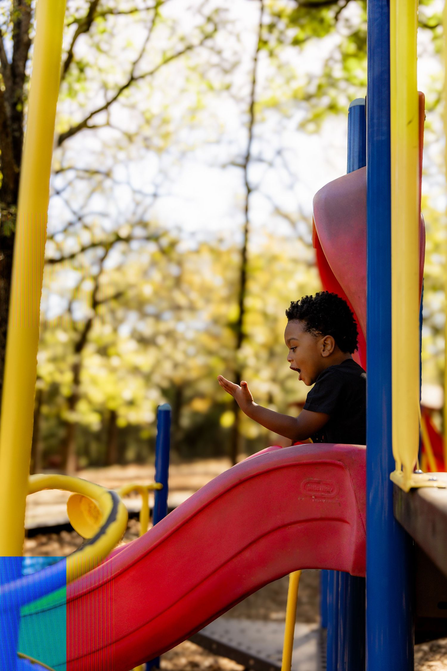 Boy going down the slide