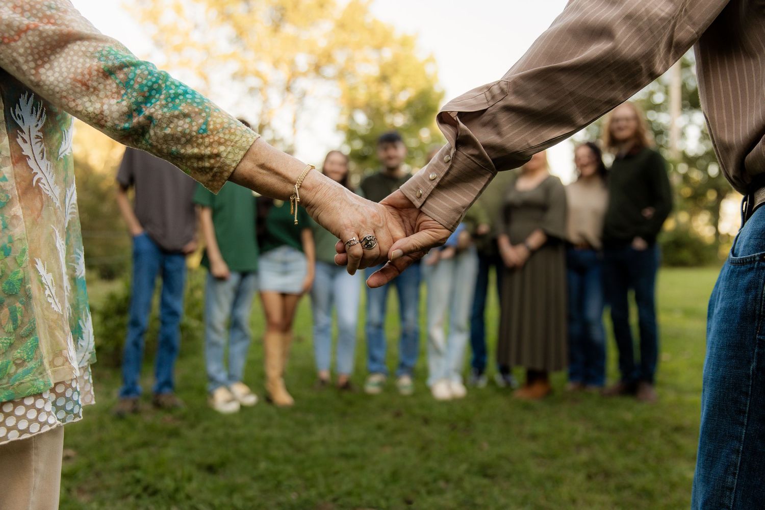 Extended Family Session holding hands looking at family