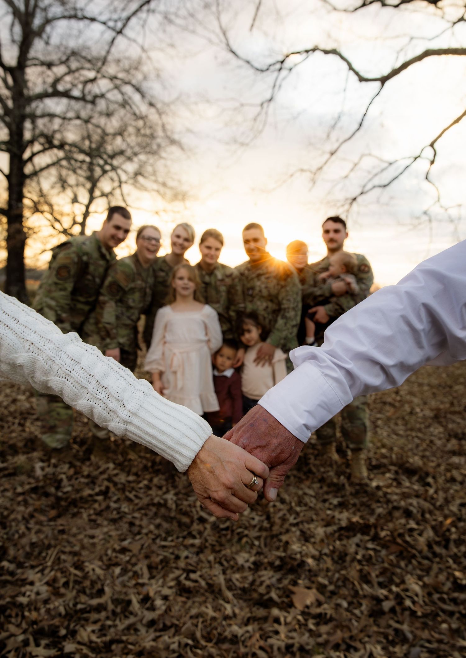 Military Family with starting couple holding hands