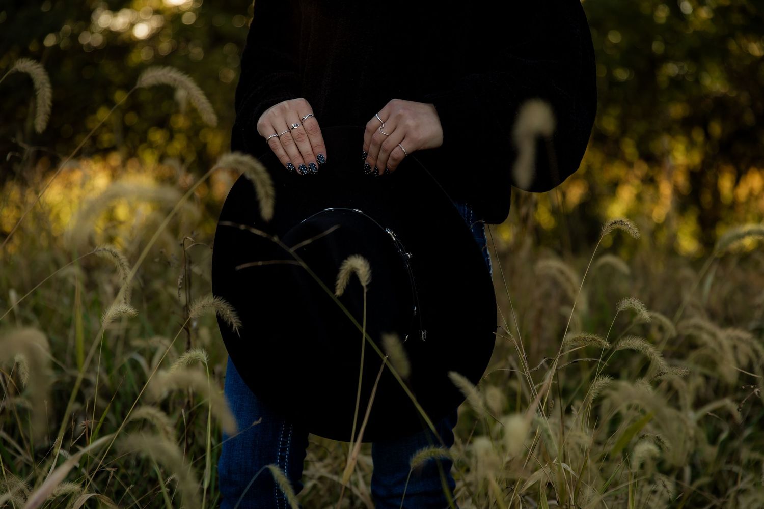 Detail shot of girl holding a cowboy had