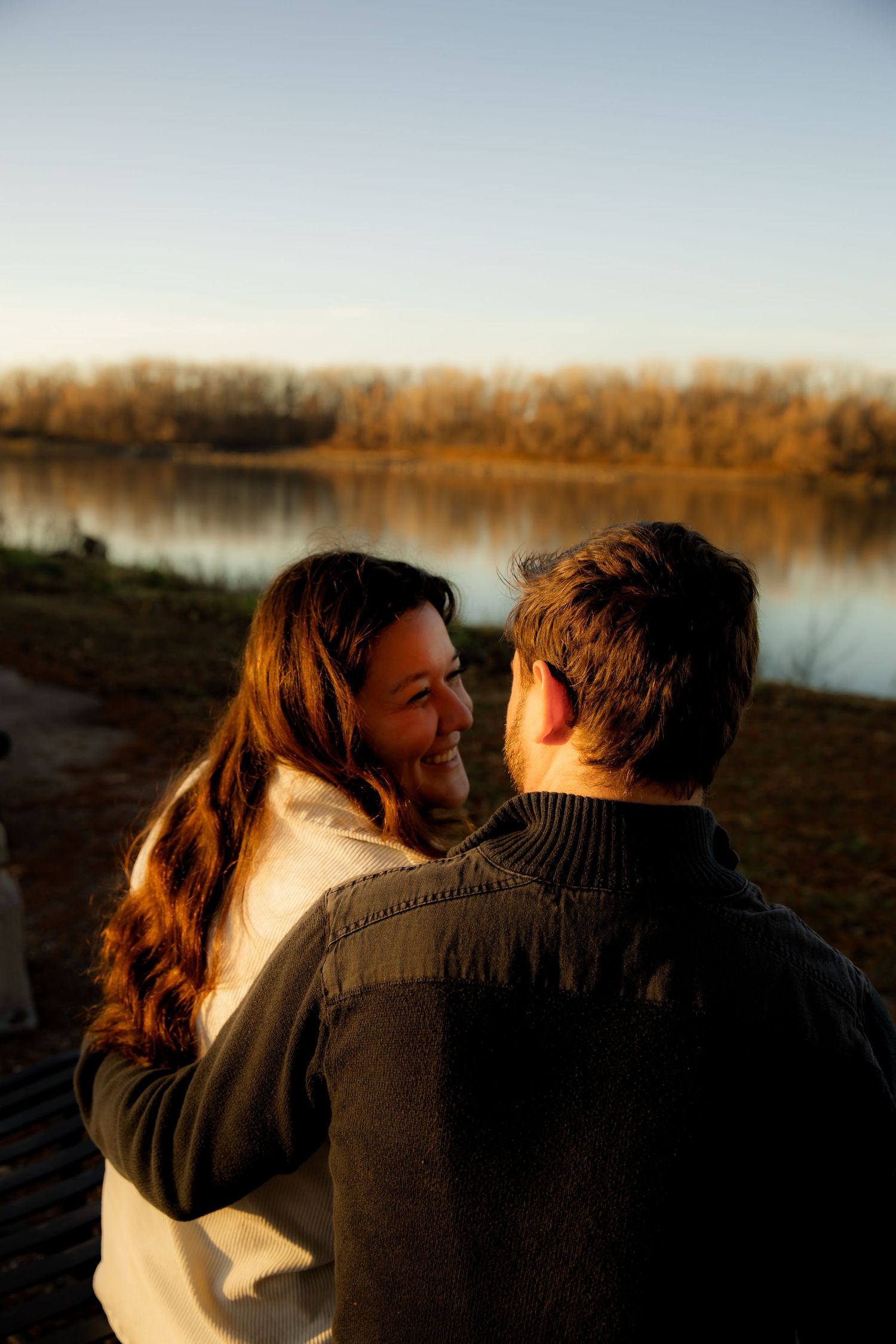 Sitting on Bench in front of Missouri River and similing at each other