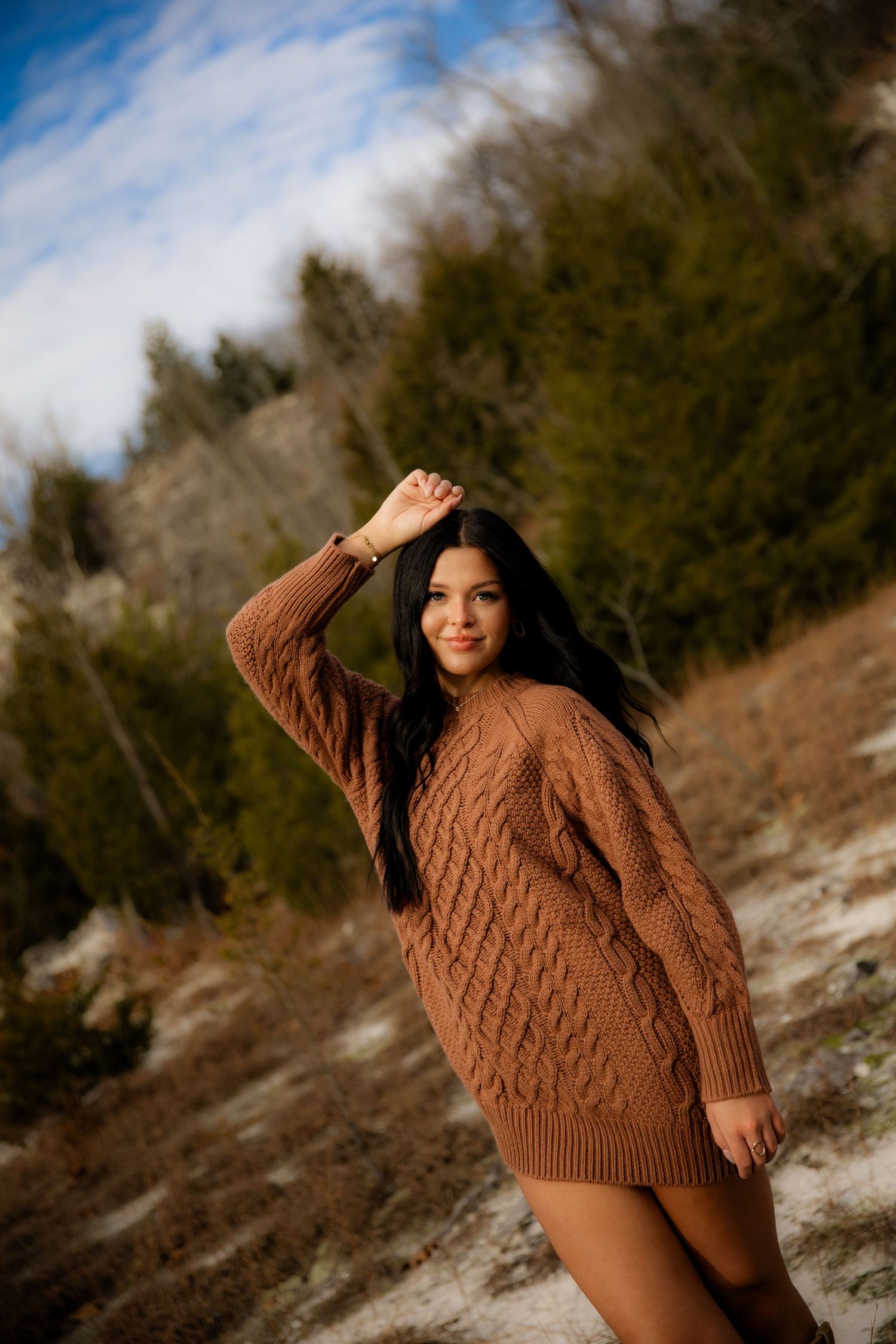 Senior photos girl holding hand above head