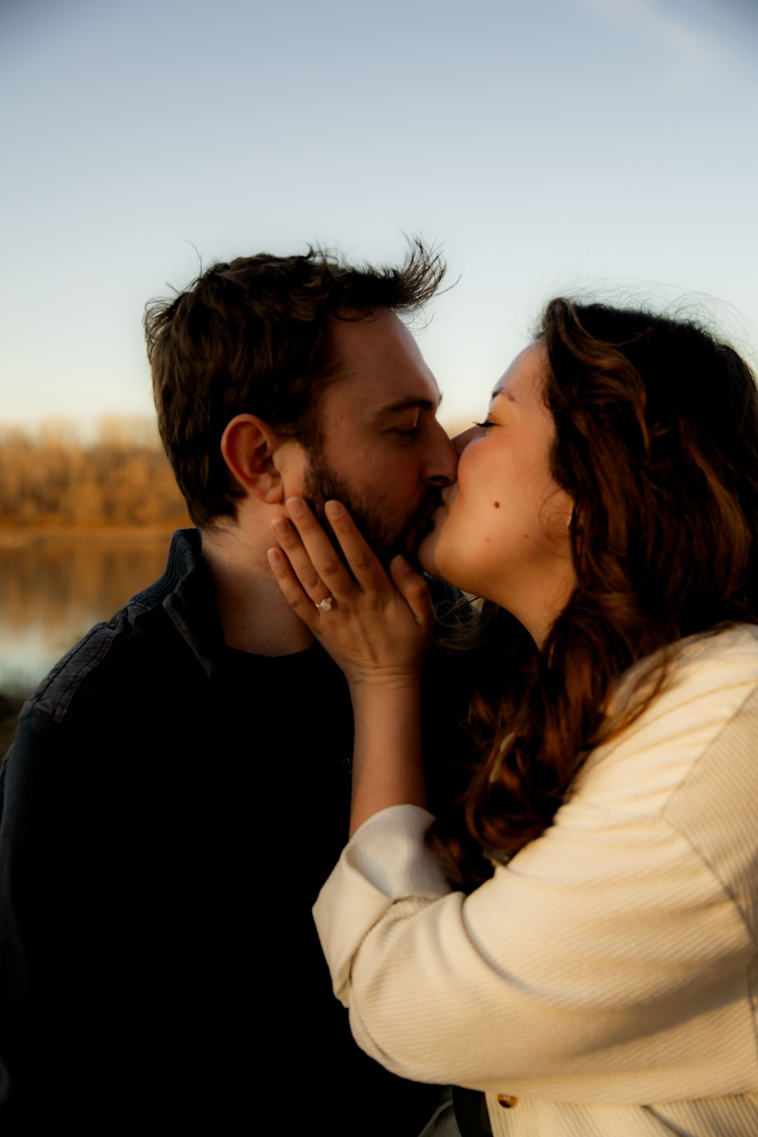 Cupping face and kissing