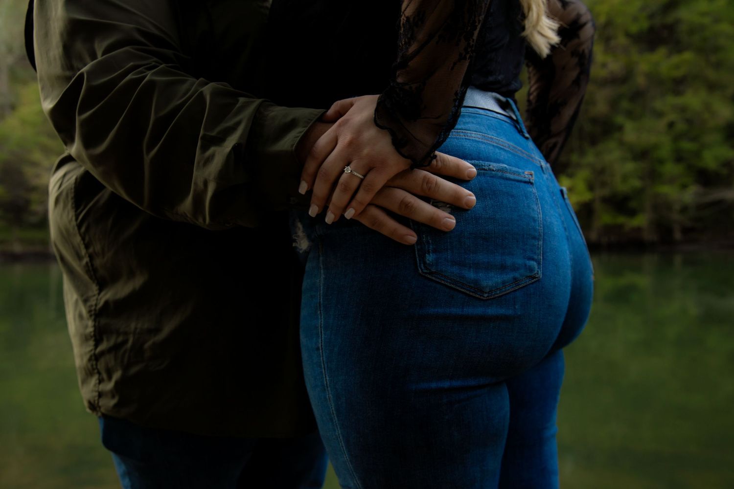 engagement ring showing jeans