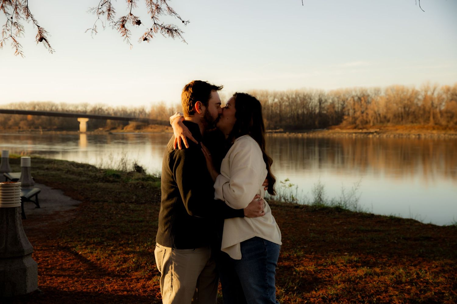 Hugging each other in front of Missouri River and kissing