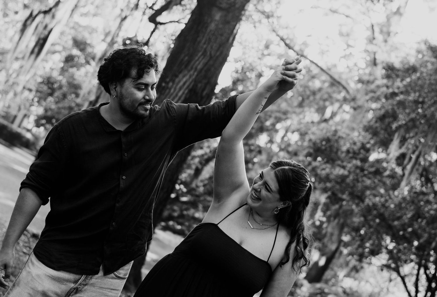 Black and white photo series capturing playful interaction between two people.