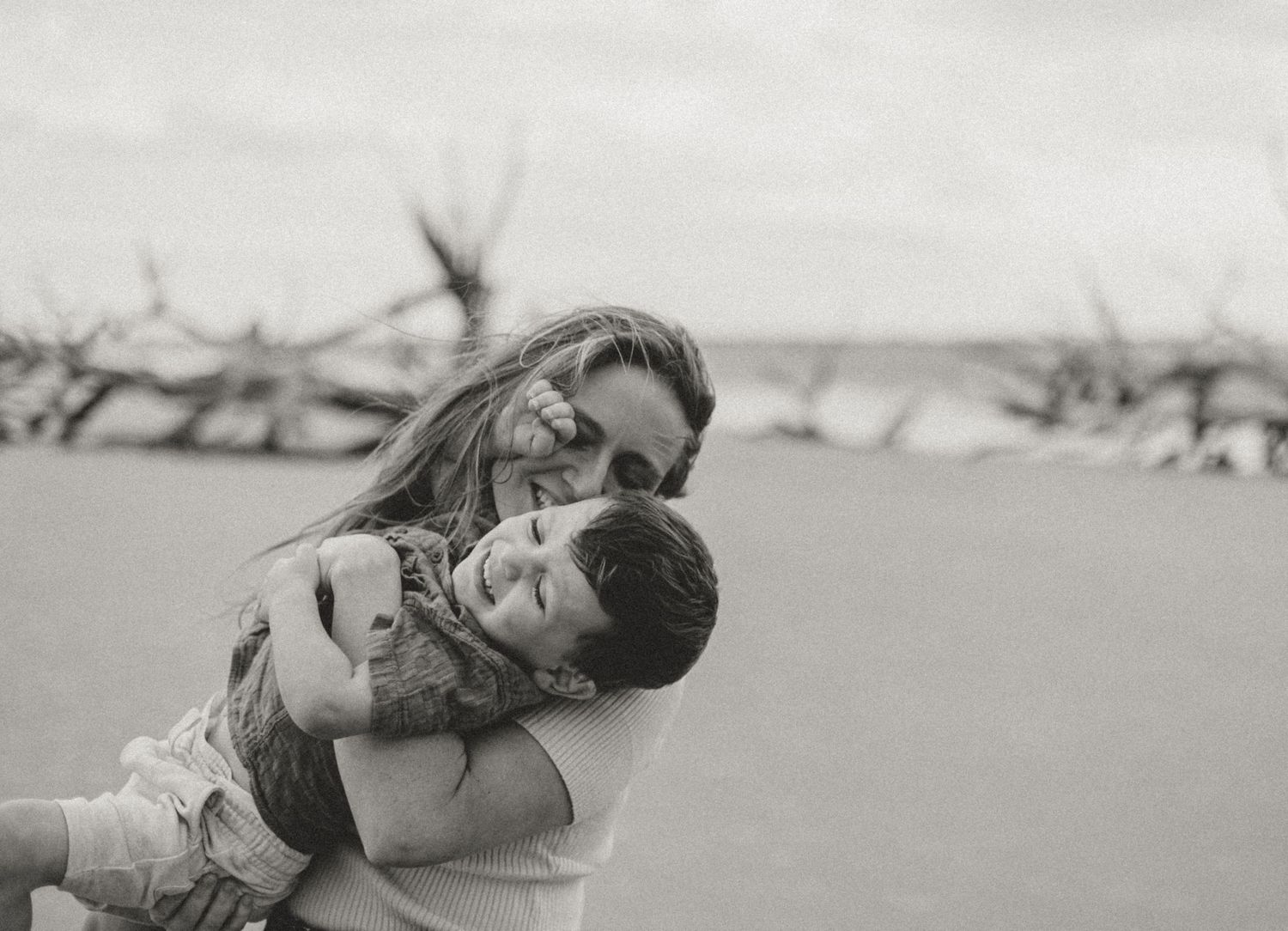 Black and white photo series showing intimate moments between two people.
