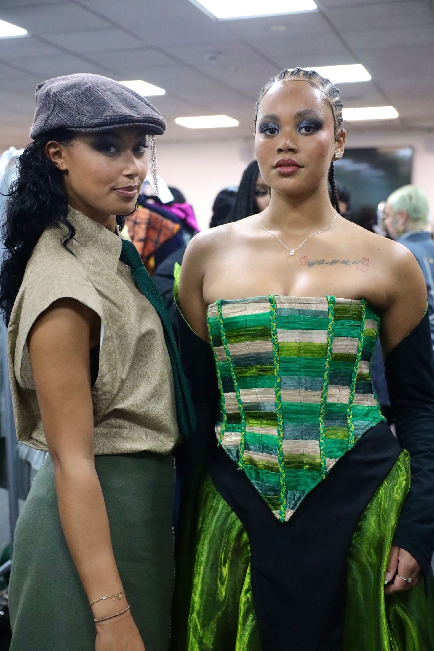 A unique fashion design features a dress made from green tea bags arranged in a geometric pattern.