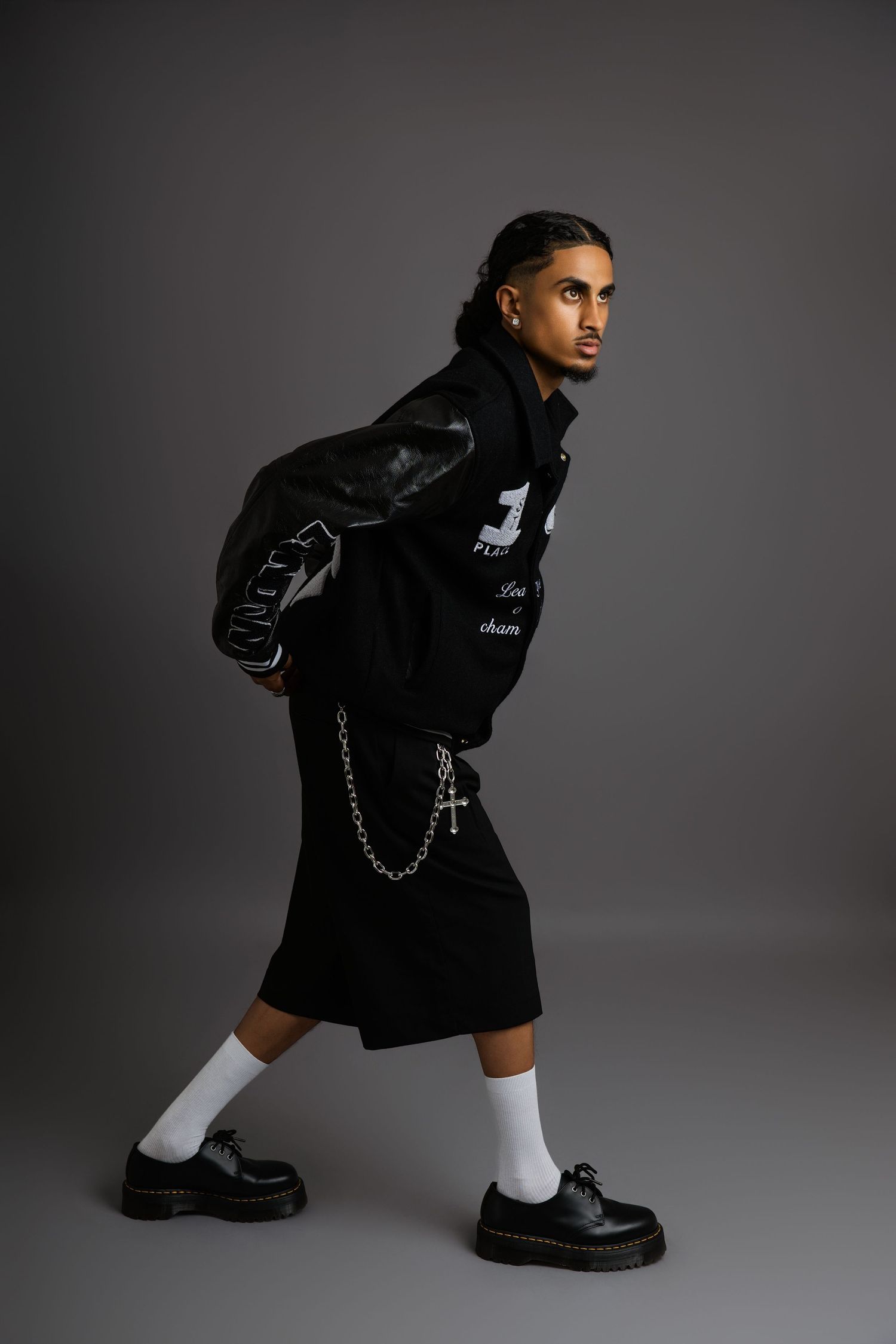 Edgy street style with black oversized jacket, white socks and chunky boots.