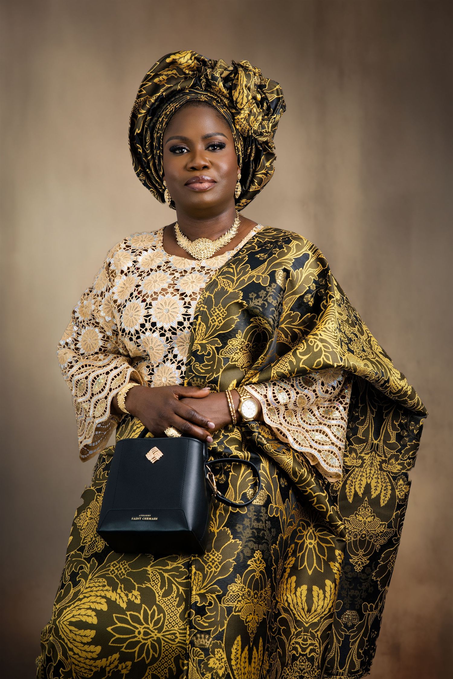 Fashion series showcasing luxurious gold and black traditional African gown with handbag accessories.