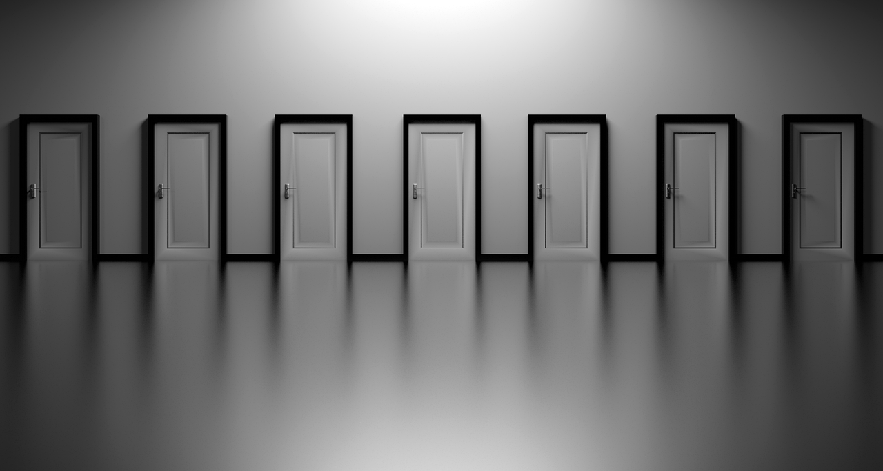 Abstract architectural photograph showing repeating geometric patterns in grayscale.