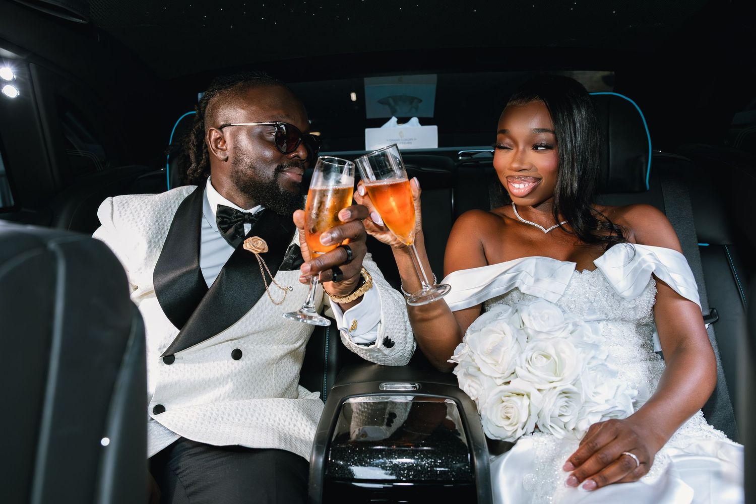 Candid wedding reception moments captured in dramatic black and white photography.