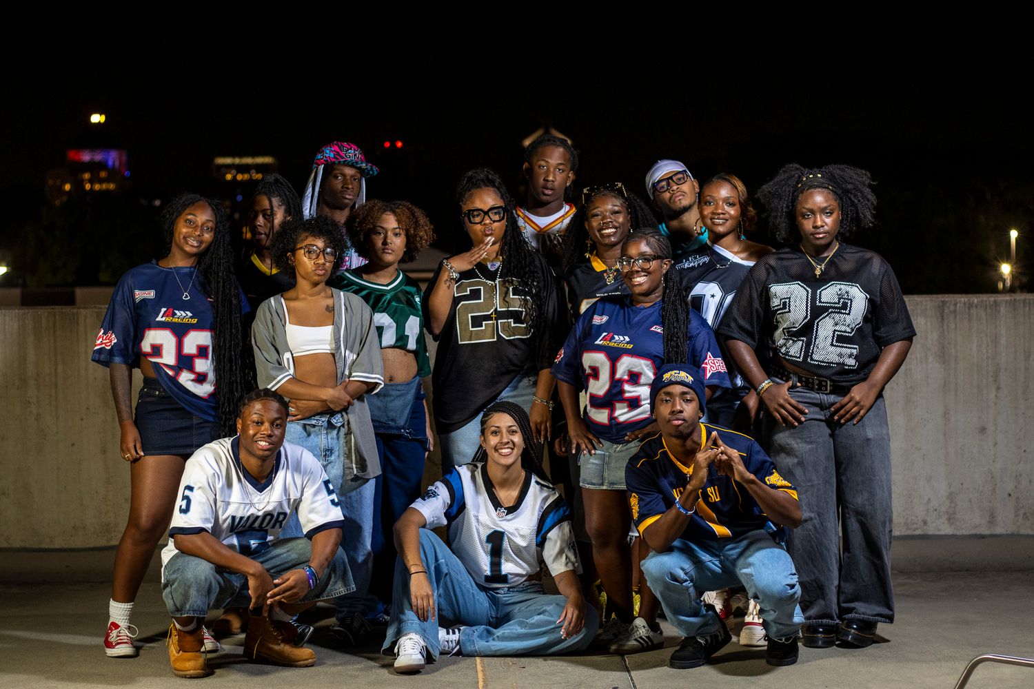 Group of diverse students wearing UCLA apparel gather together in various outdoor university campus settings.