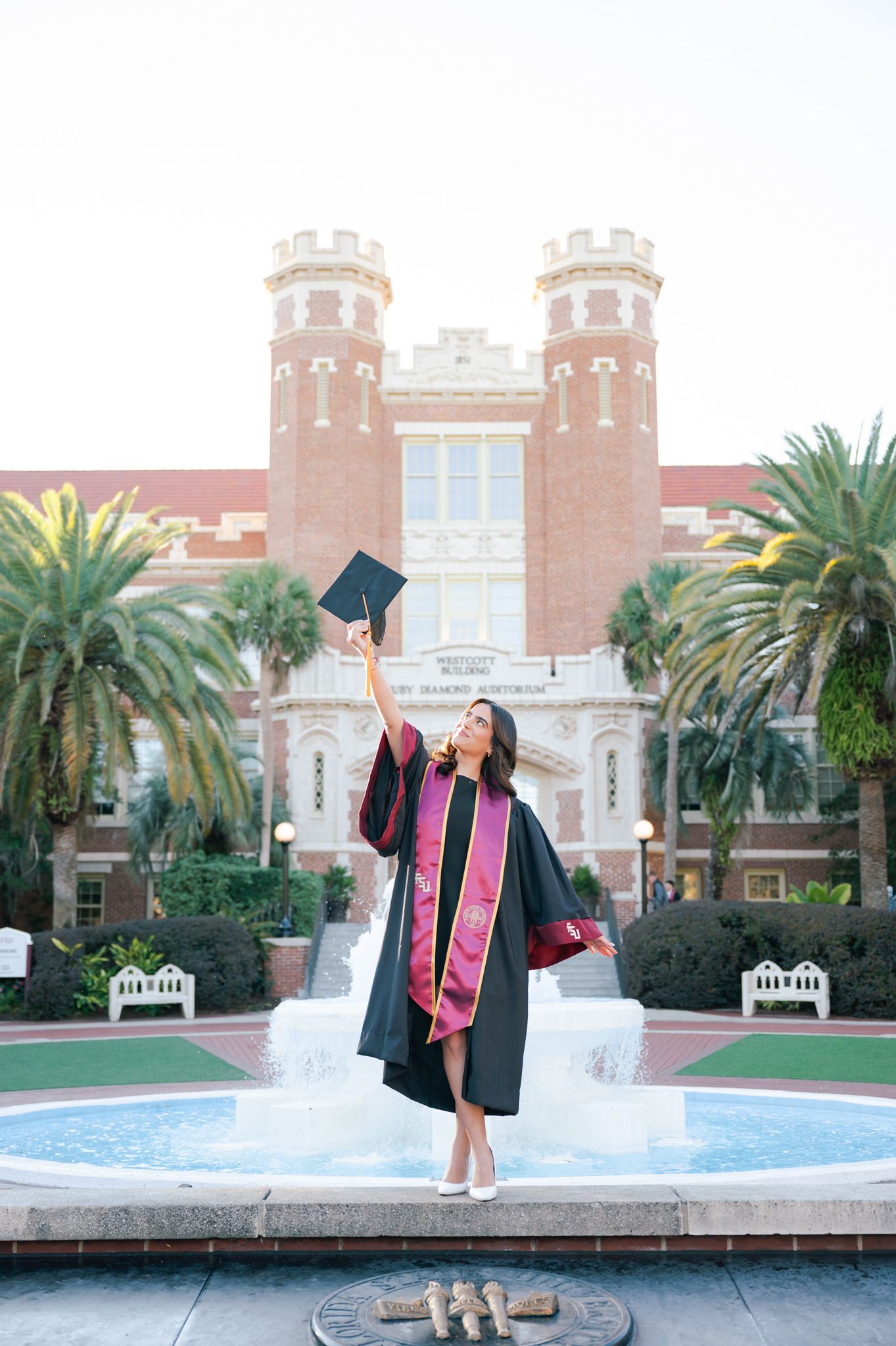 Graduation celebration photos in front of Florida State University fountain and historic building.
