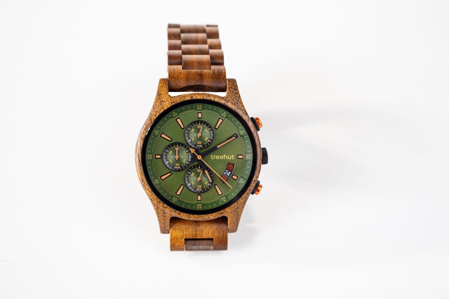 Overhead view of wooden chronograph watch with green dial face on white background.