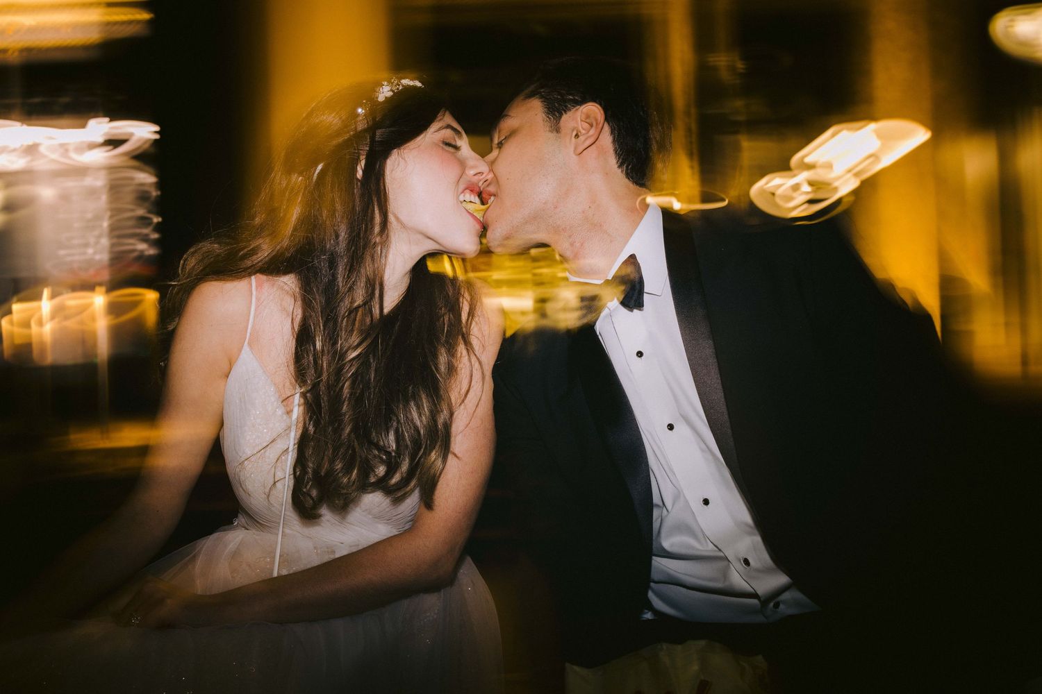 Warm ambient lighting creates an intimate atmosphere during an indoor evening celebration.
