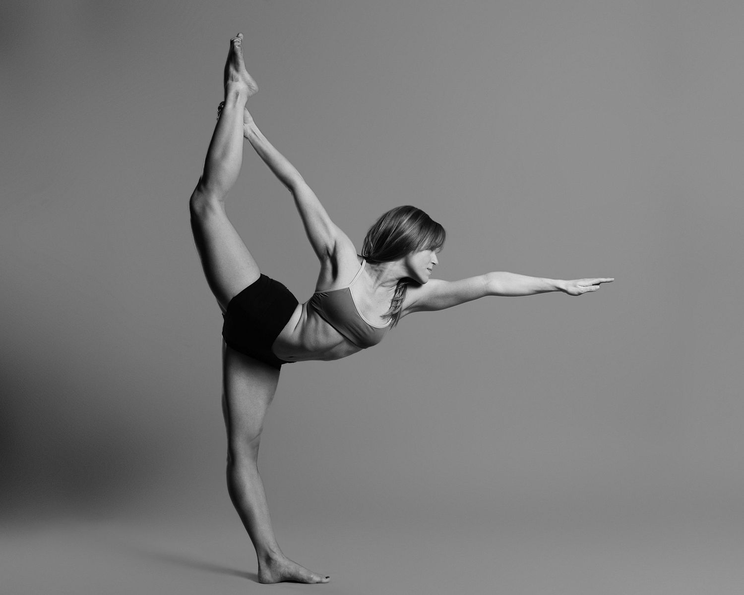 Black and white photo sequence showing a graceful ballet dancer performing fluid movements.