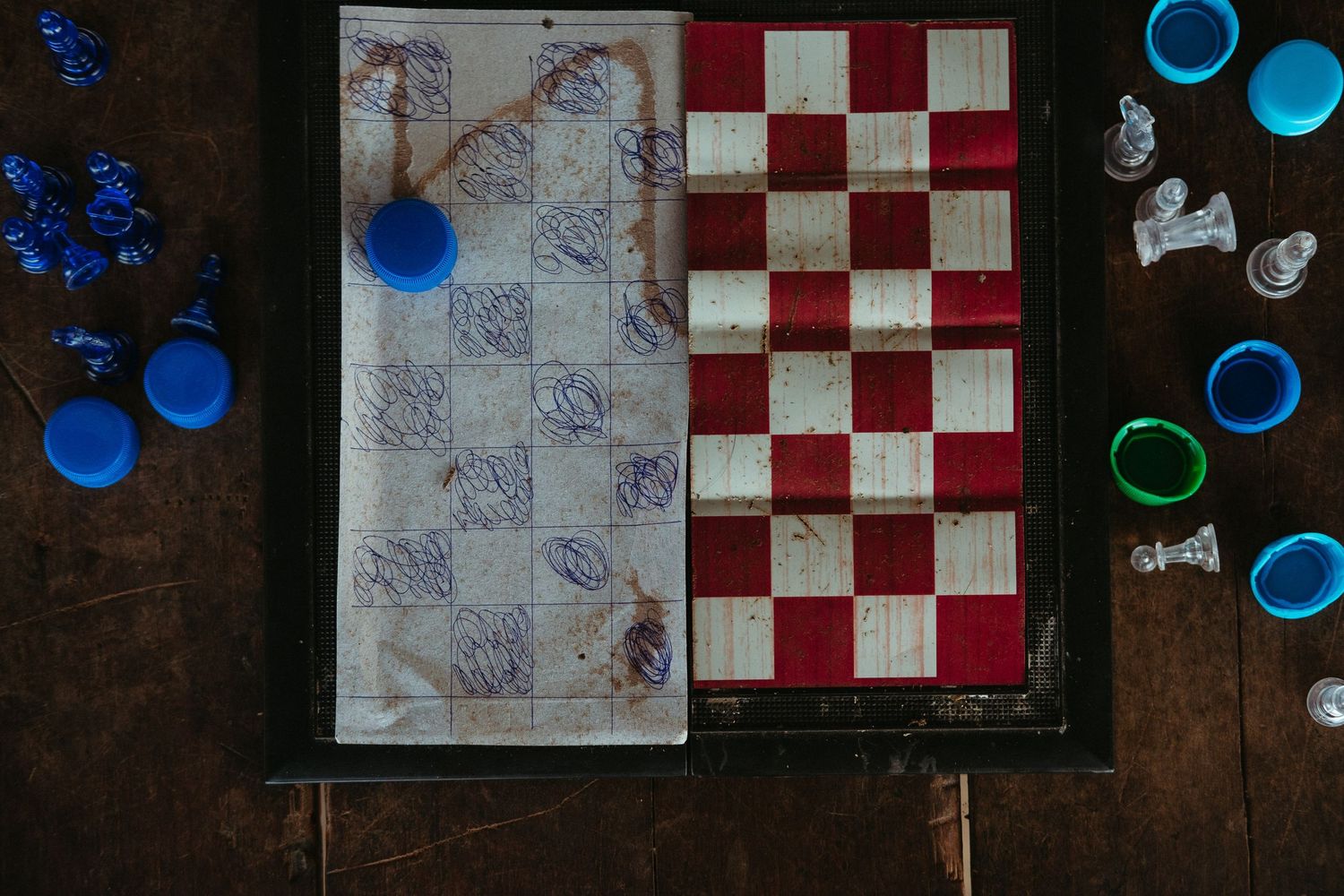 Red and white checkerboard pattern with blue decorative elements against dark background.