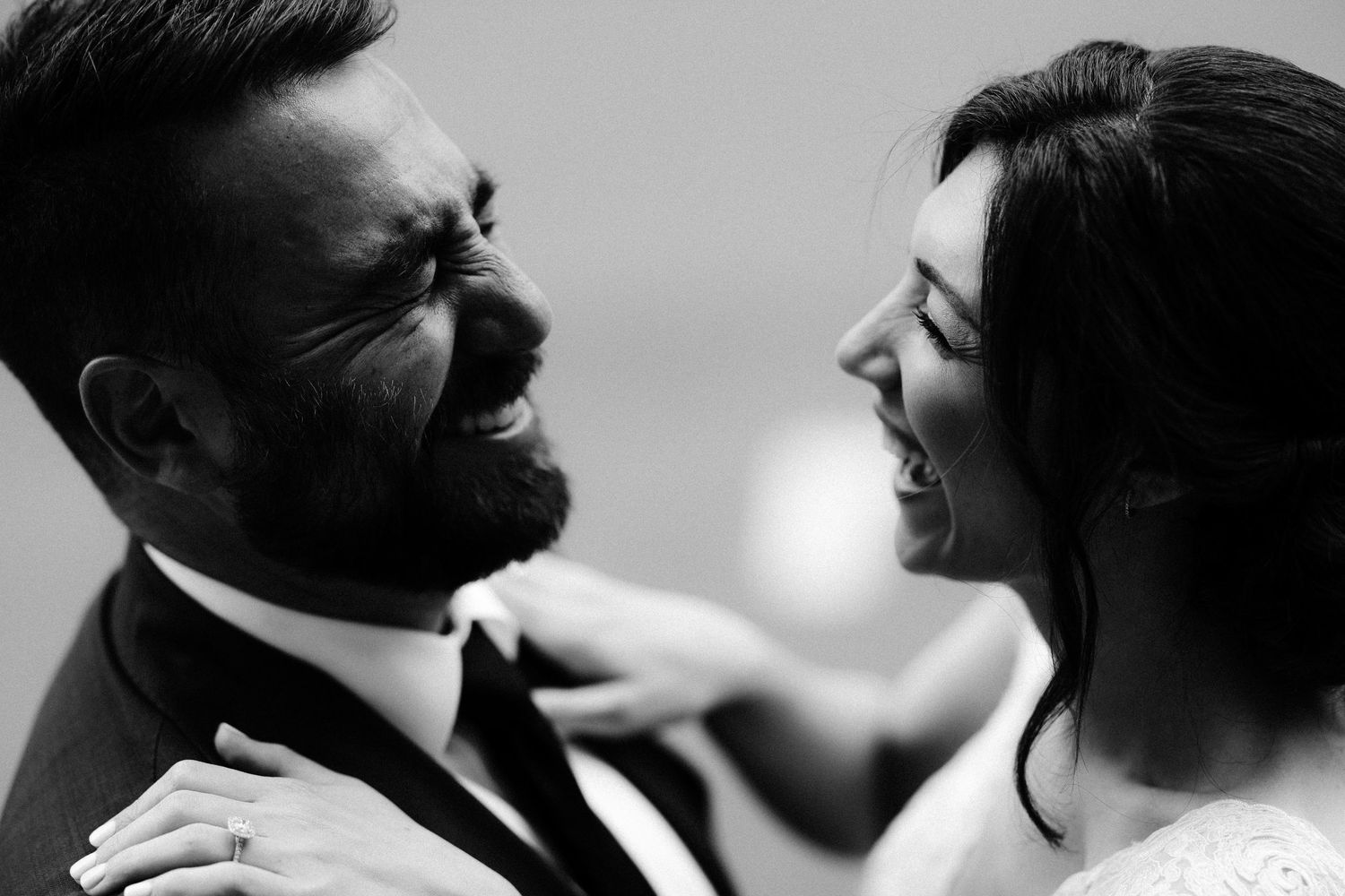 Black and white close-up artistic wedding photography showing romantic moments between a couple.