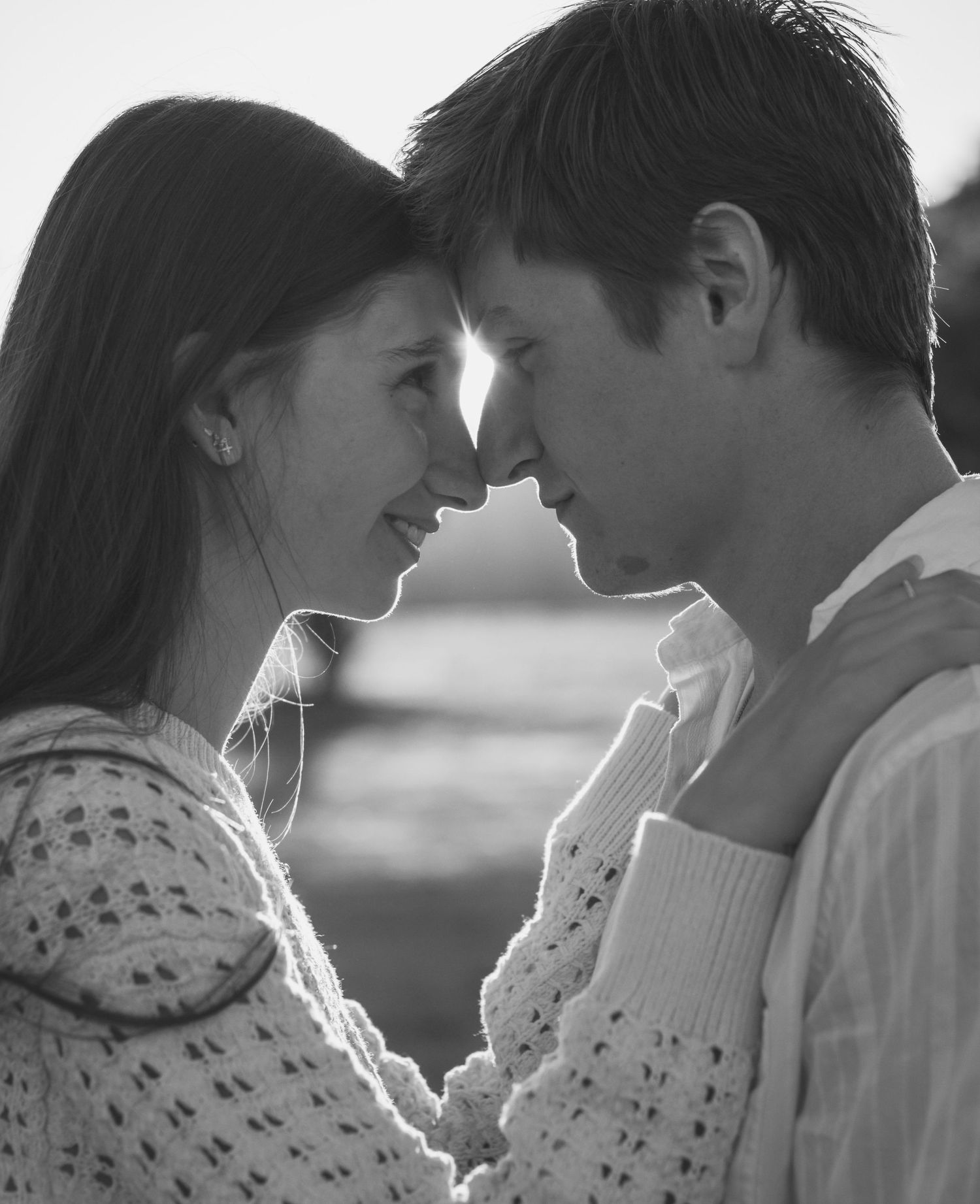 Intimate close up of couple embracing during a cinematic love story session in natural light in Redmond, WA